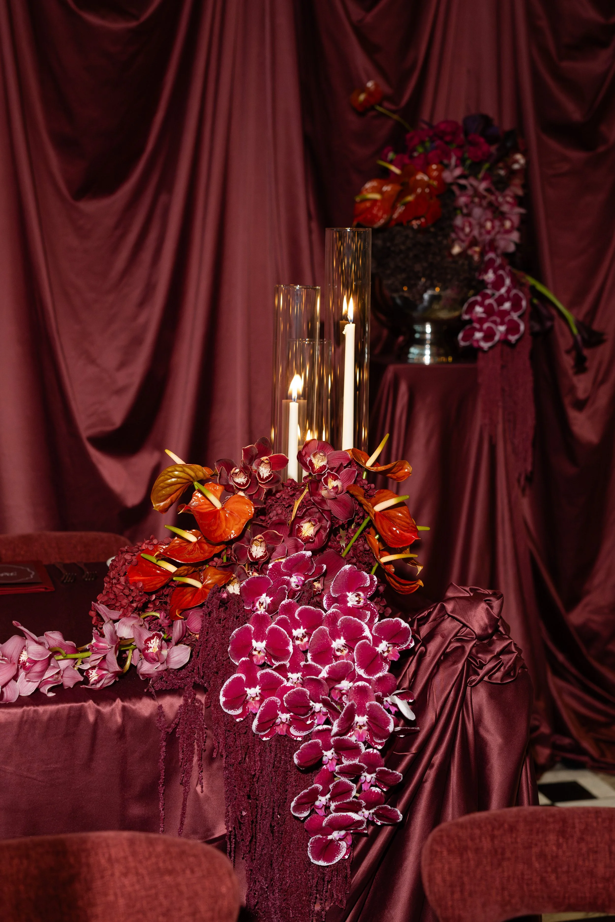 Jihan and Rob’s reception florals in deep burgundy and pink at Luci Melbourne