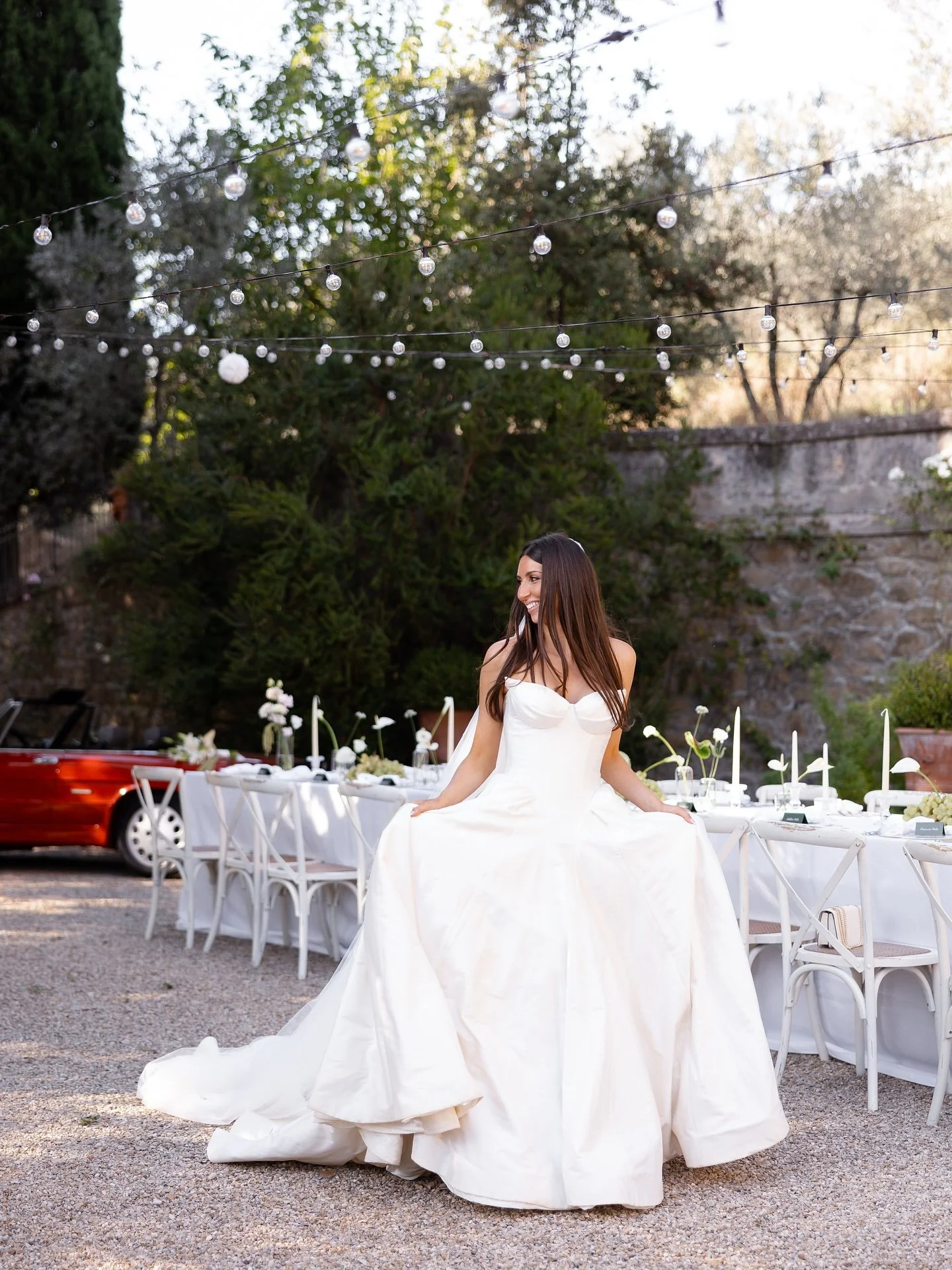 Bride Marilena in her gown in the villa garden