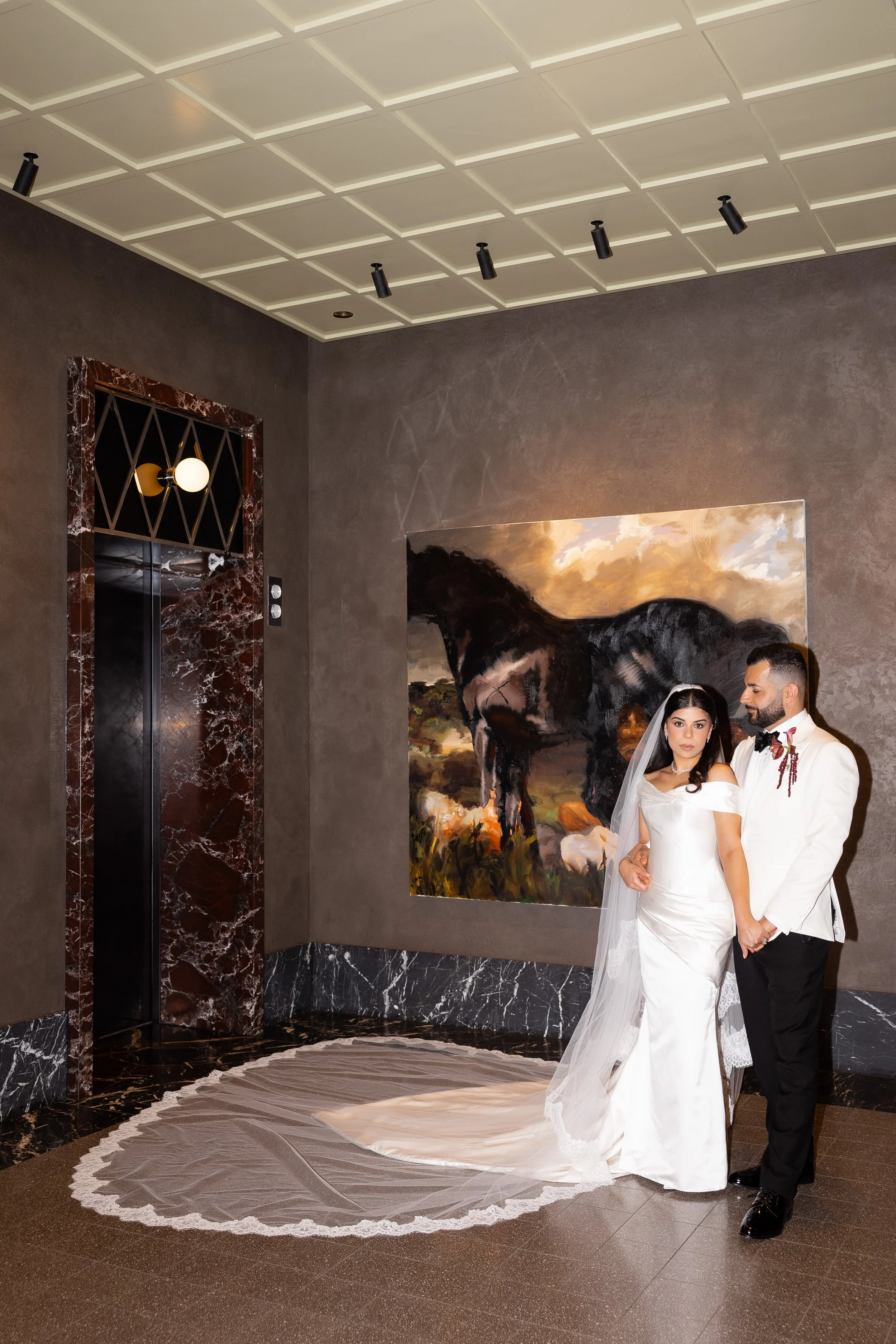 Jihan and Rob together by a fireplace in the hotel