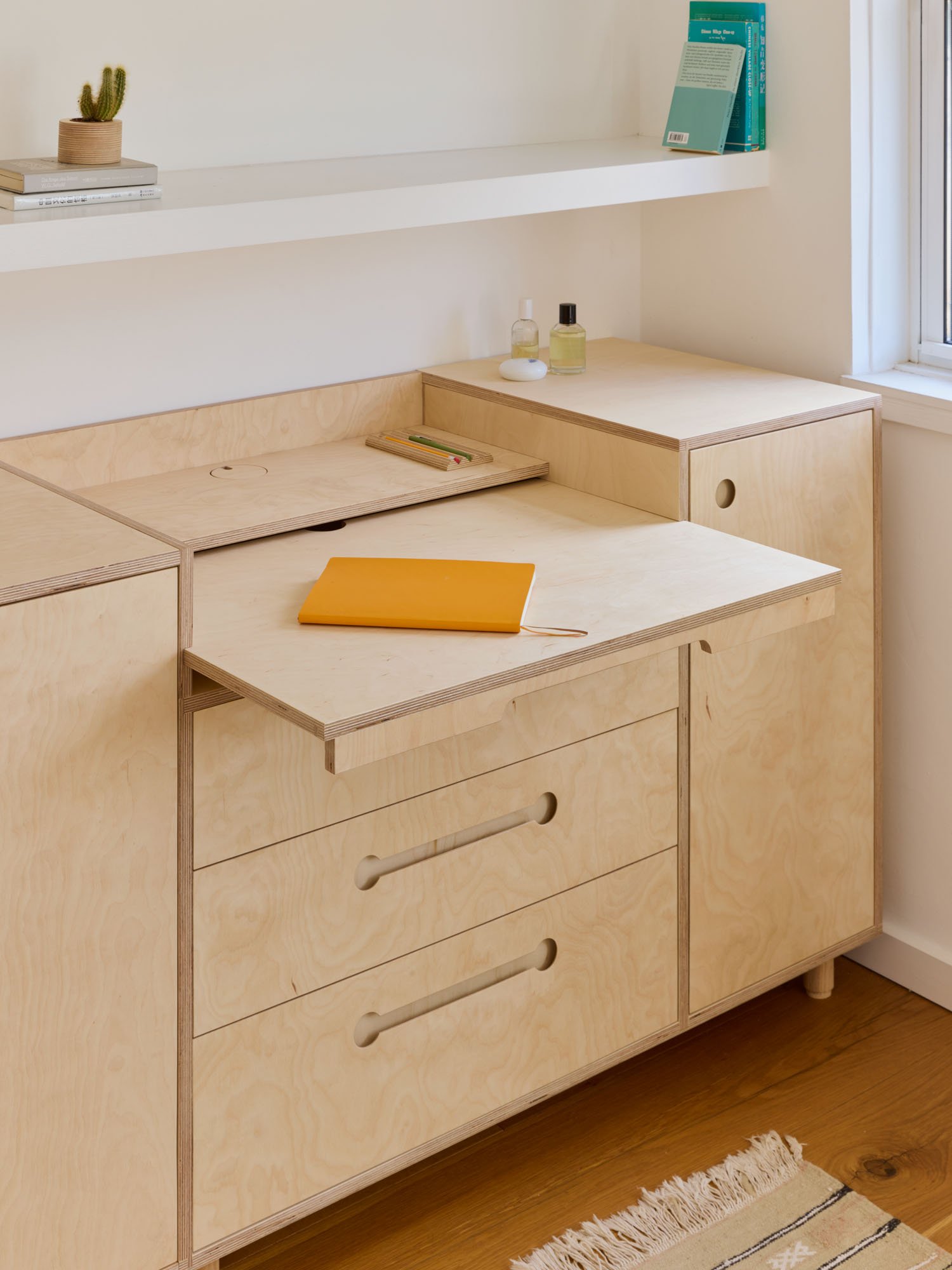 Lozi_bespoke_plywood_bedroom_furniture_short_wardrobe_Gerda_Konrad_2_low_res_pull_out_desk_dressing_table_extended.jpg