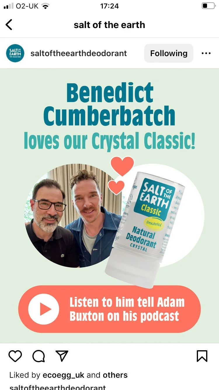 An Instagram post promoting Salt of the Earth's crystal deodorant with a photo of Adam Buxton and Benedict Cumberbatch, and a red button with a play icon and text encouraging listening to Adam Buxton's podcast.