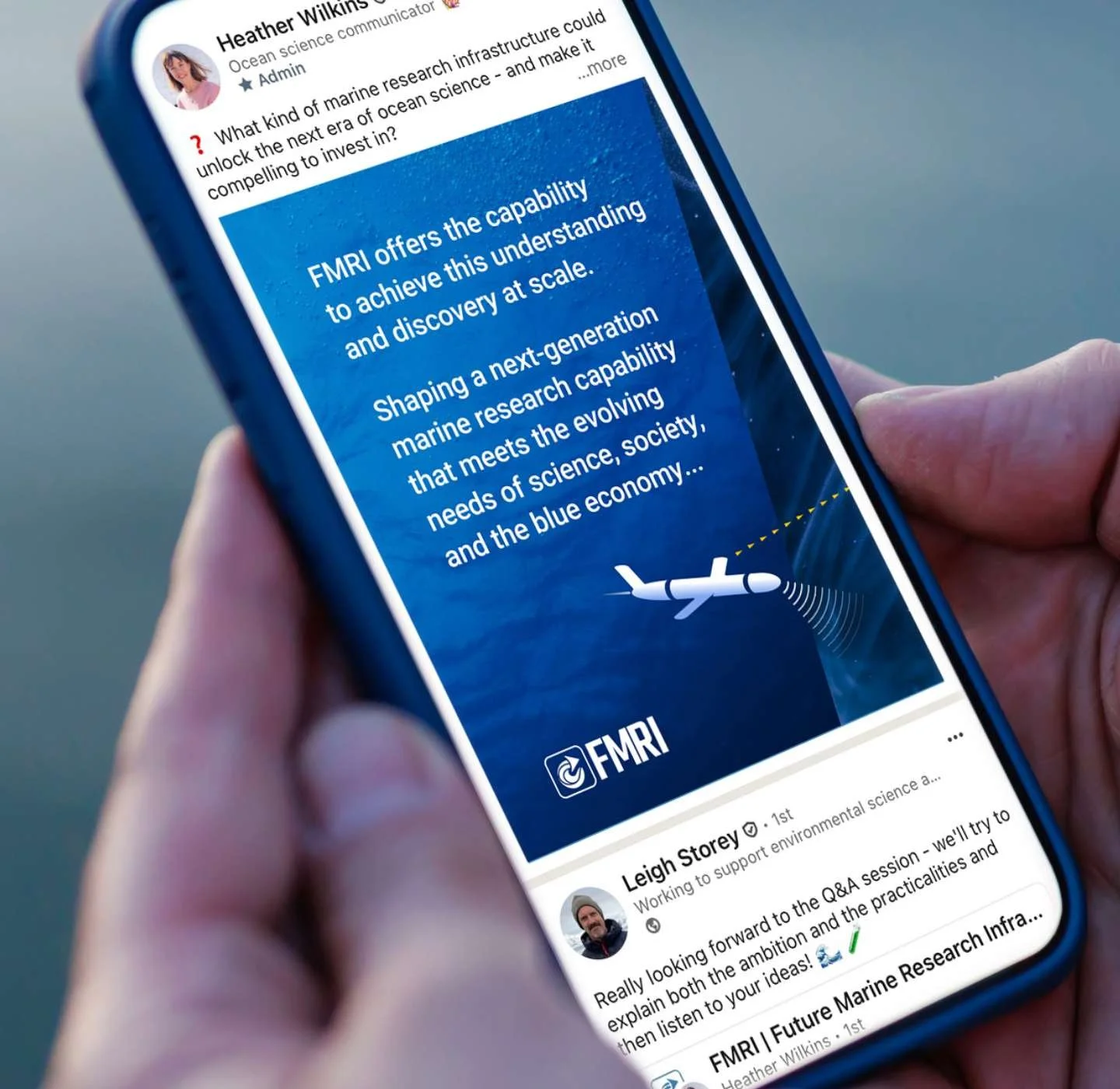 Smartphone screen displaying a social media post about FMRI technology, with an illustration of an autonomous ocean glider emitting signals over an ocean background.