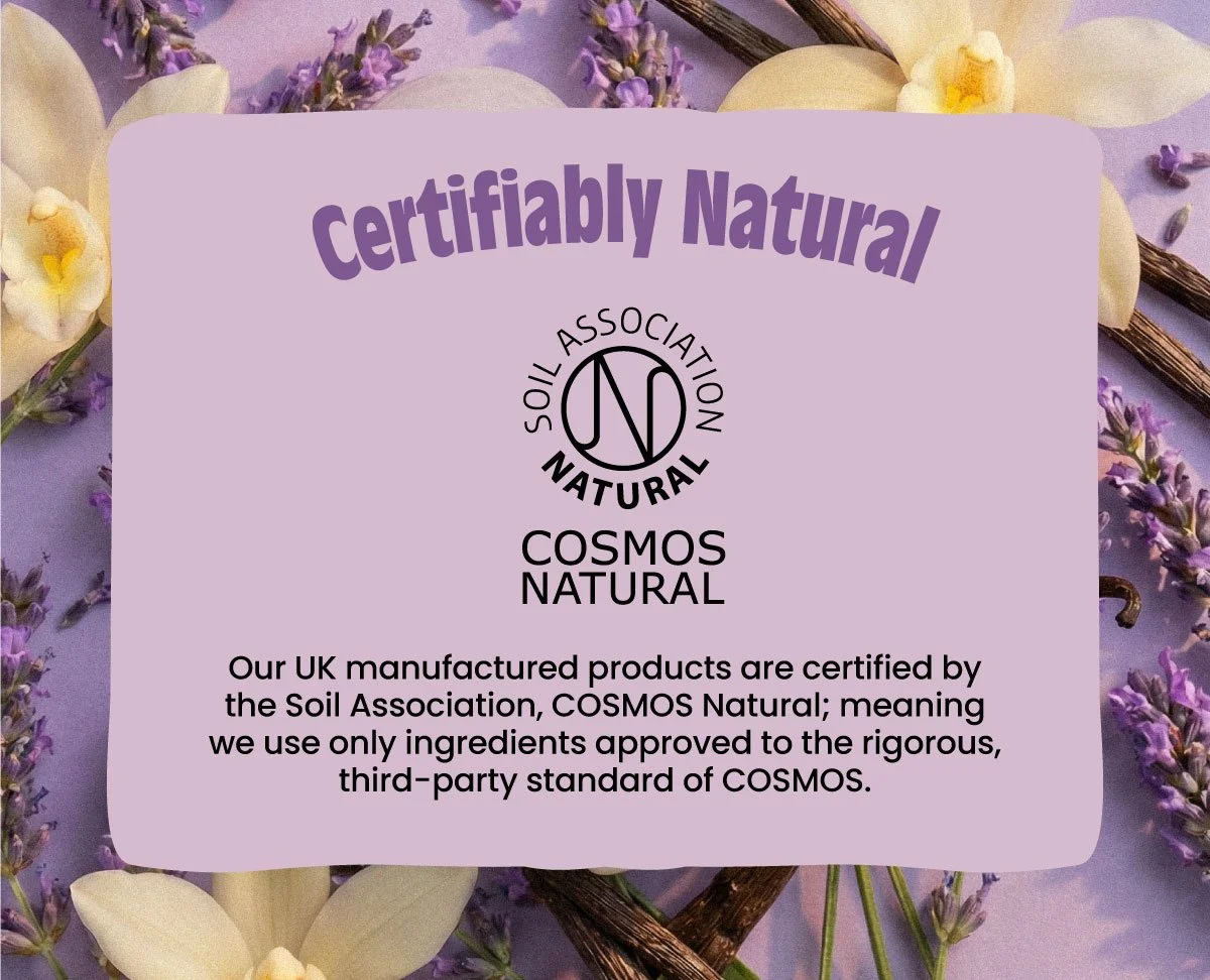 Product certification label from COSMOS Natural by Soil Association, indicating Salt of the Earth products are natural and made according to third-party standards, with a purple background and floral decorations.