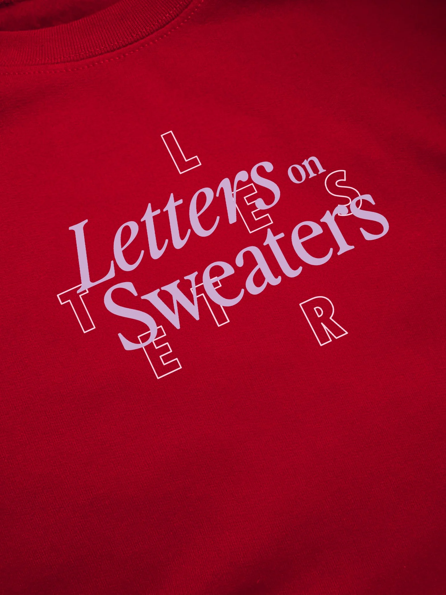 Close up detail of Letters on Sweaters design in lavender.