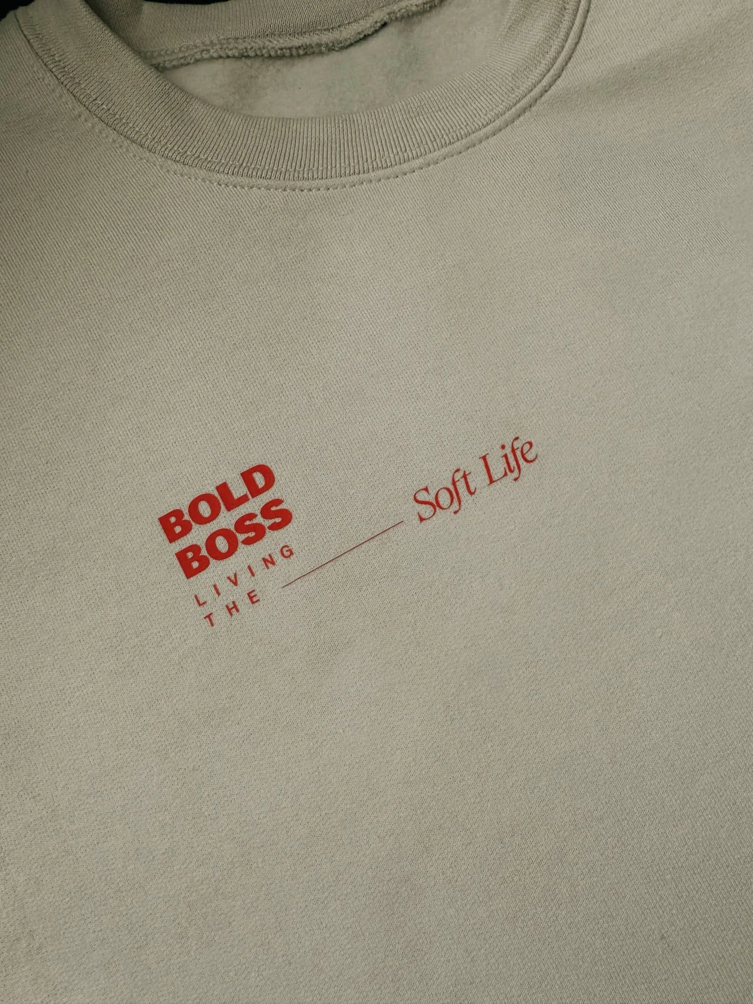 Close up detail of Bold Boss crewneck sweater