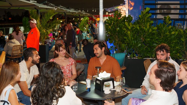 Friends celebrating around a table at La Yardita