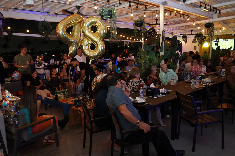 Birthday celebration with gold balloons at La Yardita