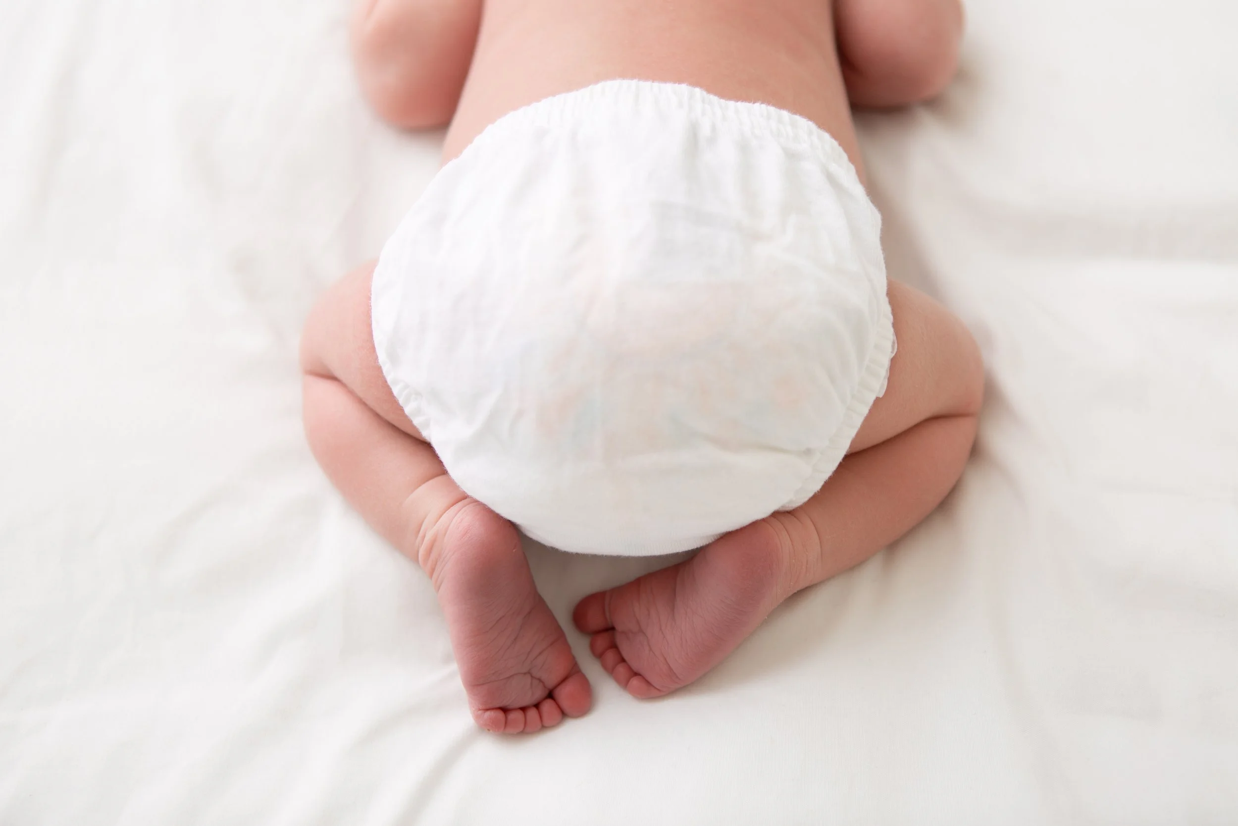 cute newborn baby bum and feet