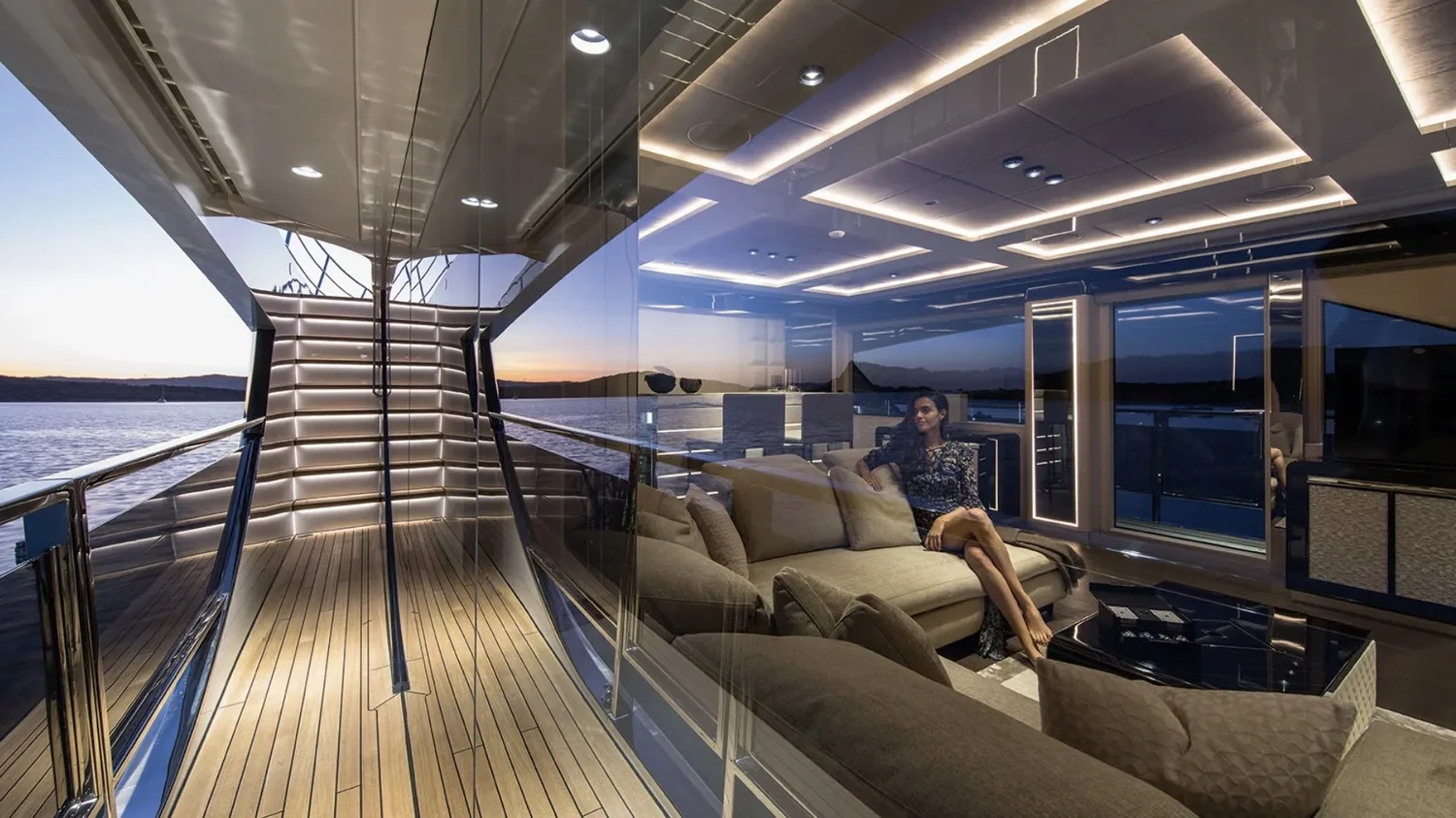 Alberto Mancini Dominator Ilumen 28 m, saloon and side deck at dusk