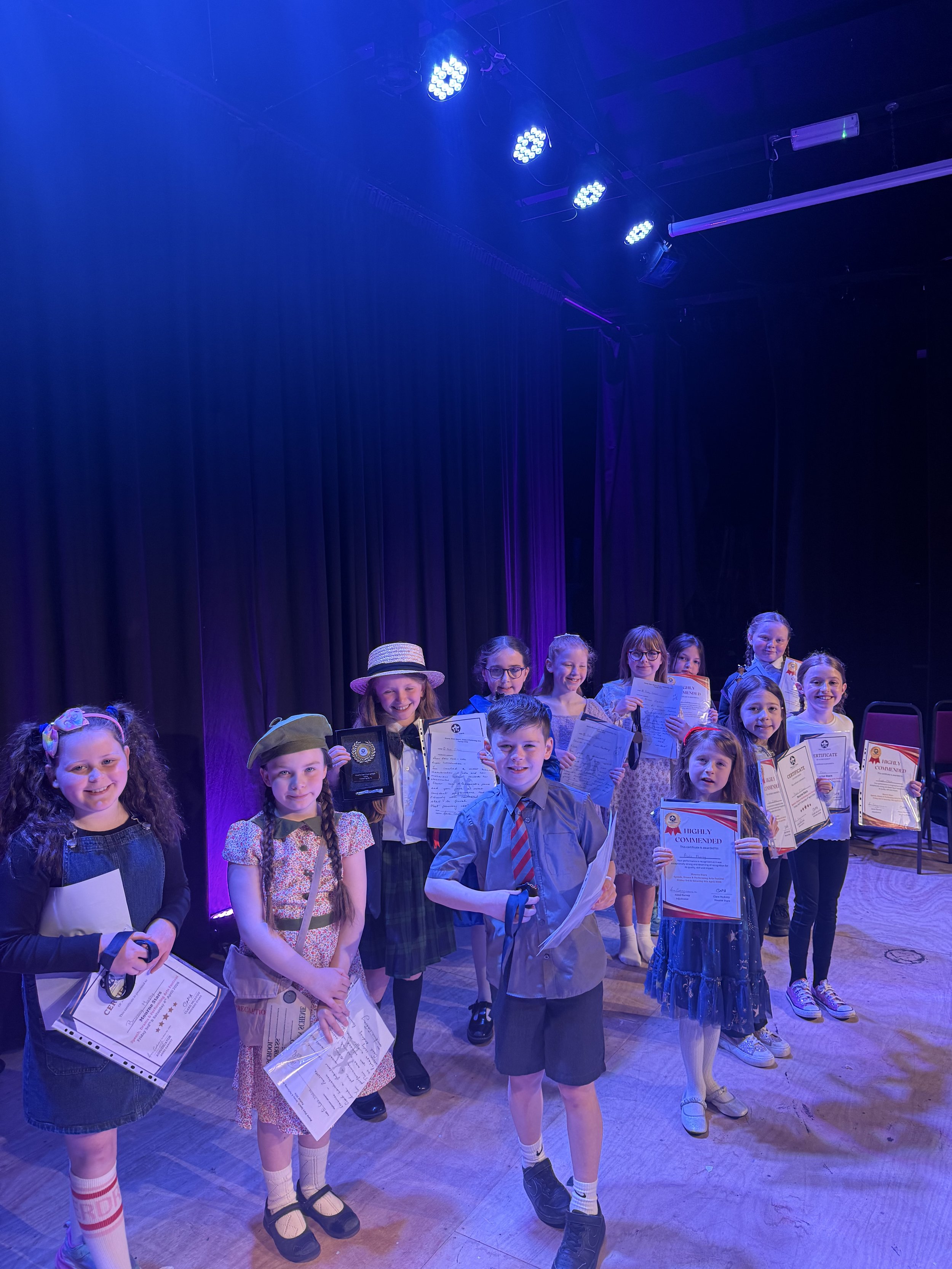 All of the young actors aged 8-10 who took part in the acting section wearing their amazing costumes supplied by their parents.jpeg