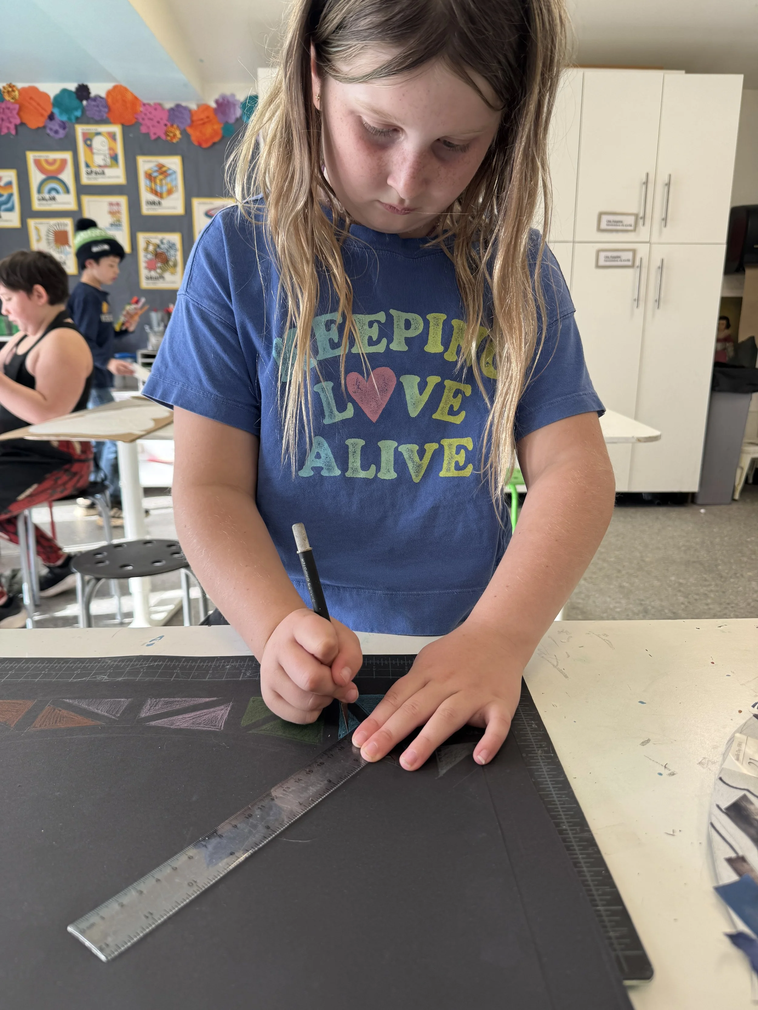 Child working on art piece
