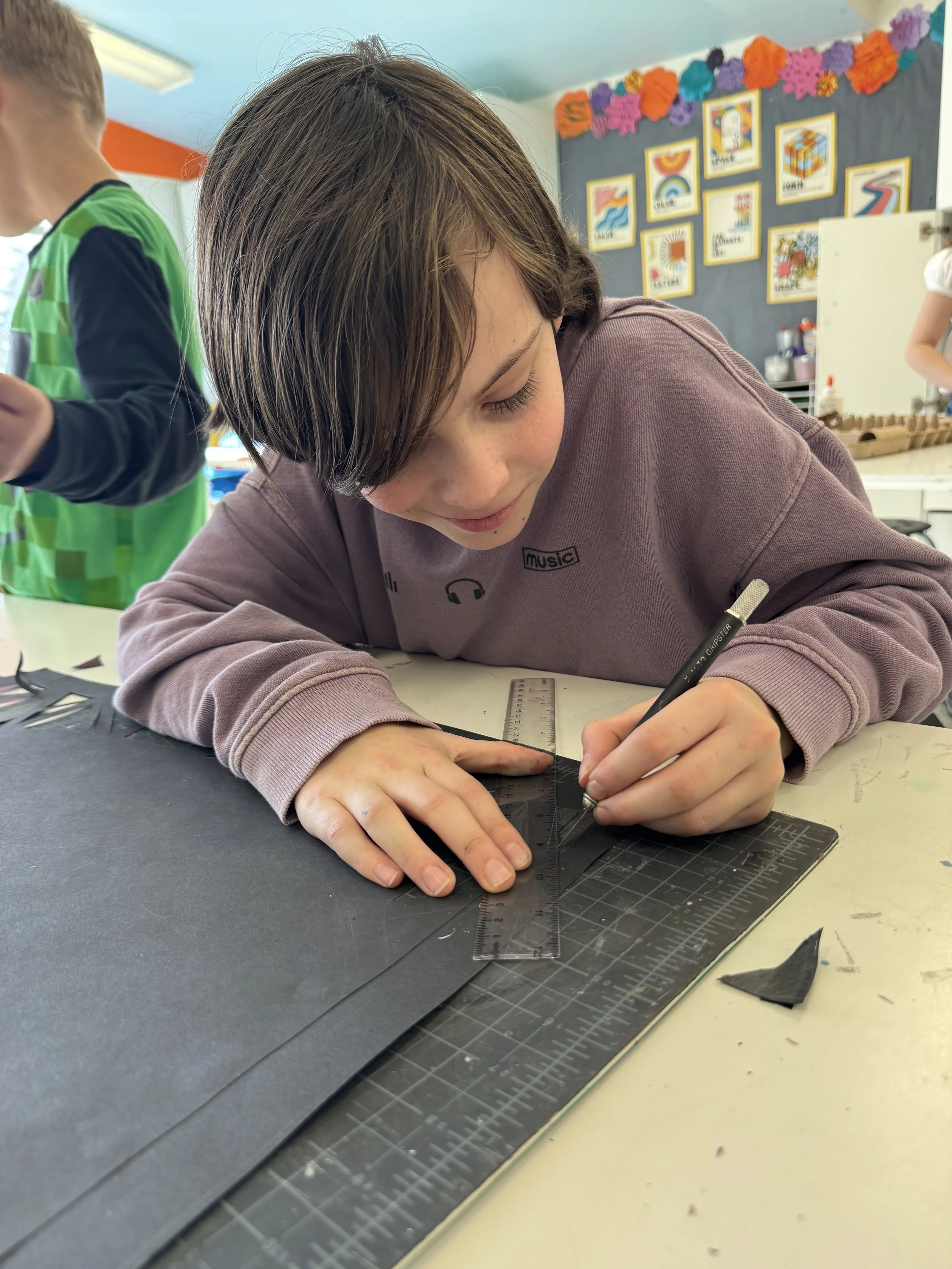 Child working on art piece