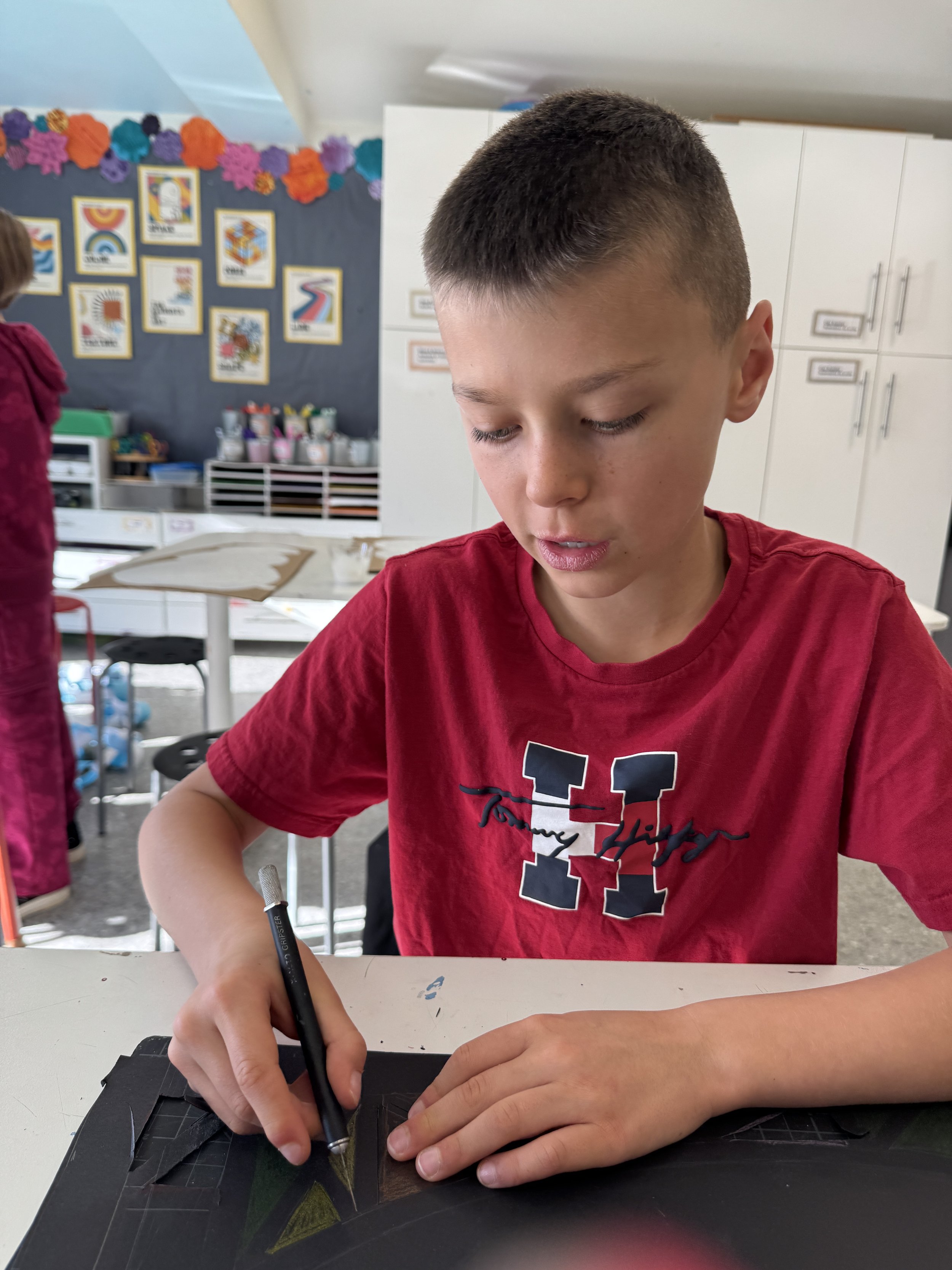 Child working on art piece