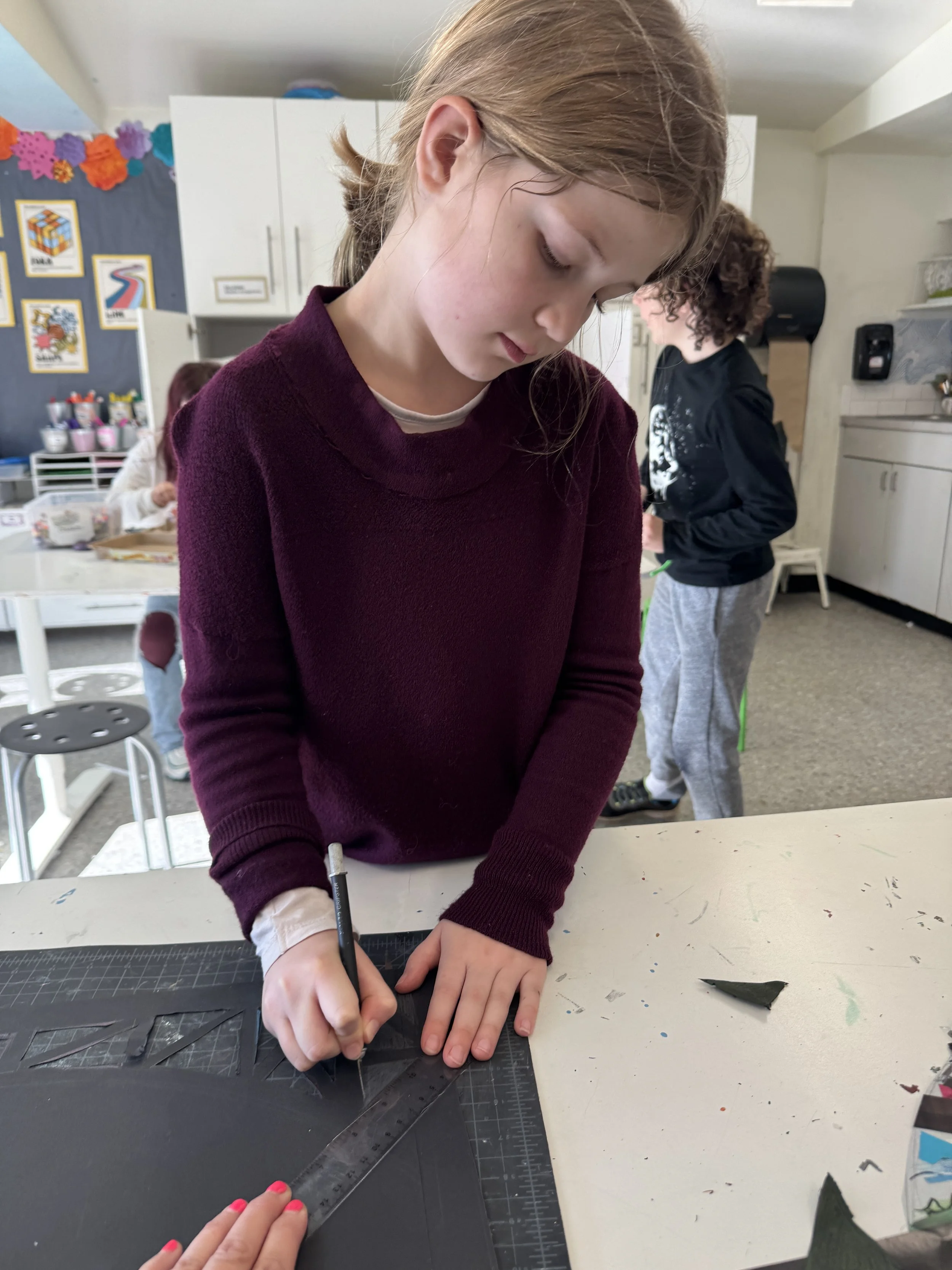 Child working on art piece