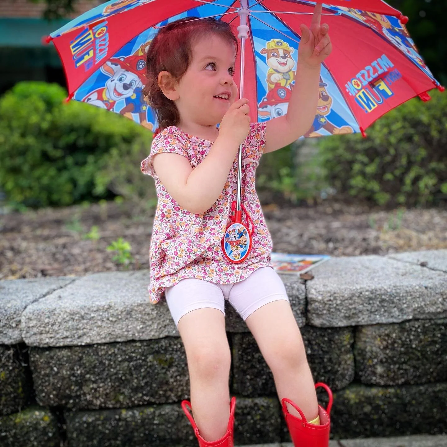 IQ wanted a picture with her umbrella, just like the big kids.