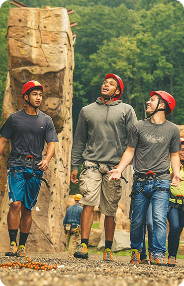 Scouts participating in rock climbing activities