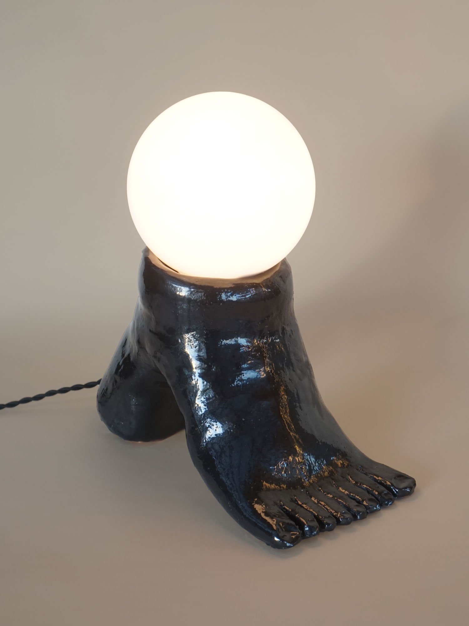 arched black foot