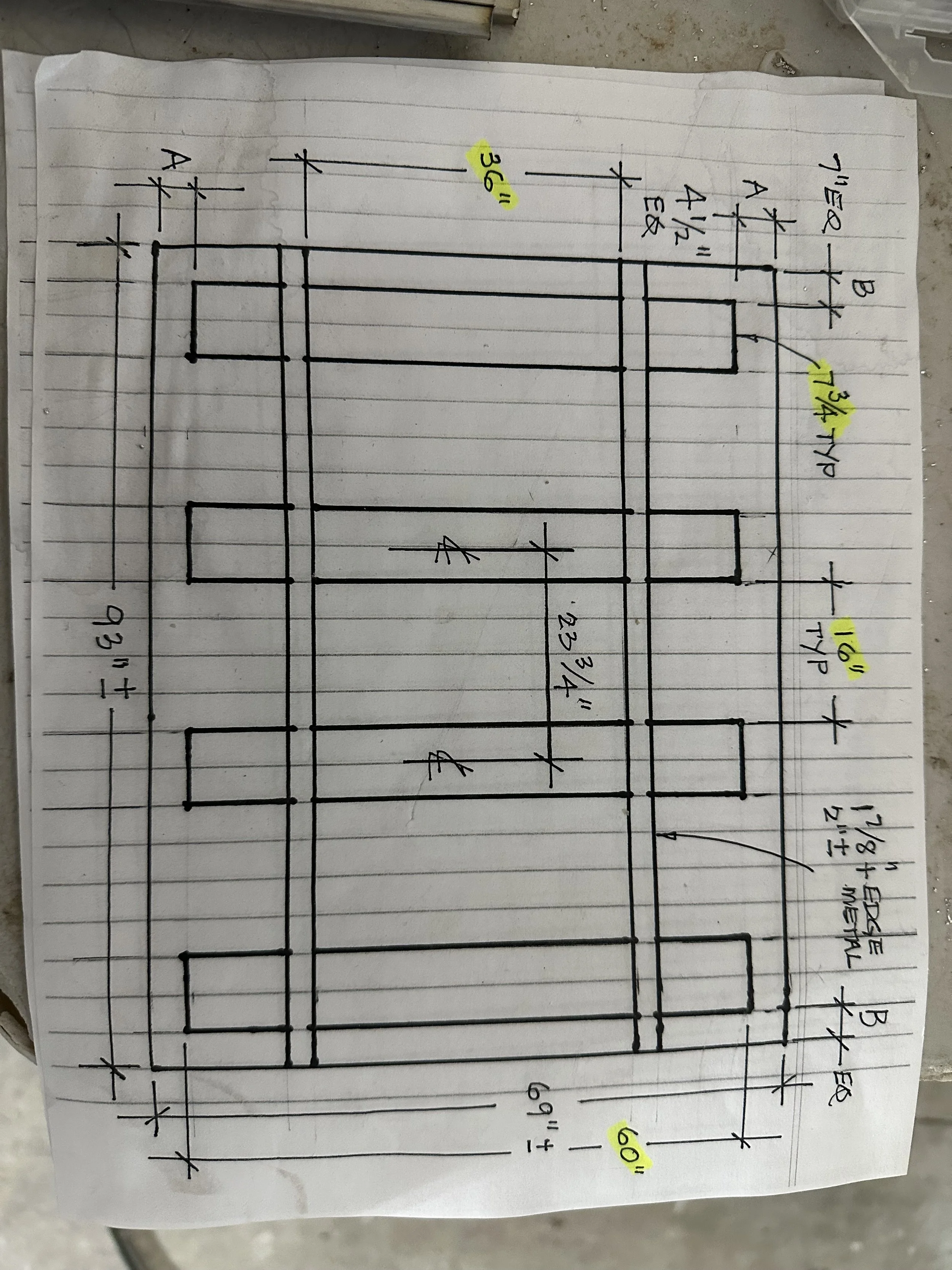  A hand-drawn construction sketch on graph paper — a dimensioned panel-spacing diagram used for planning a paneled or louvered installation. 