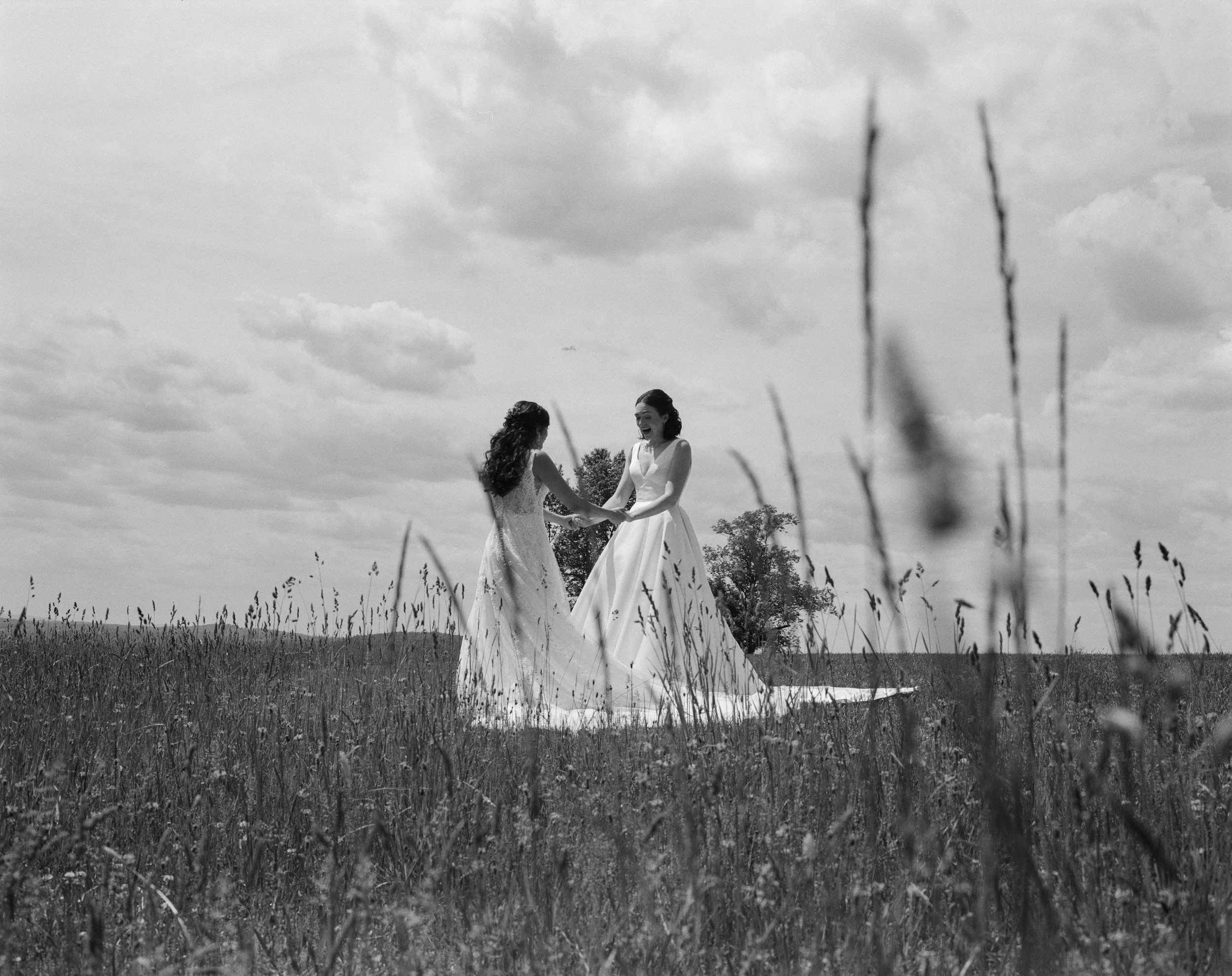 Catskills wedding on film featuring two brides during their first look
