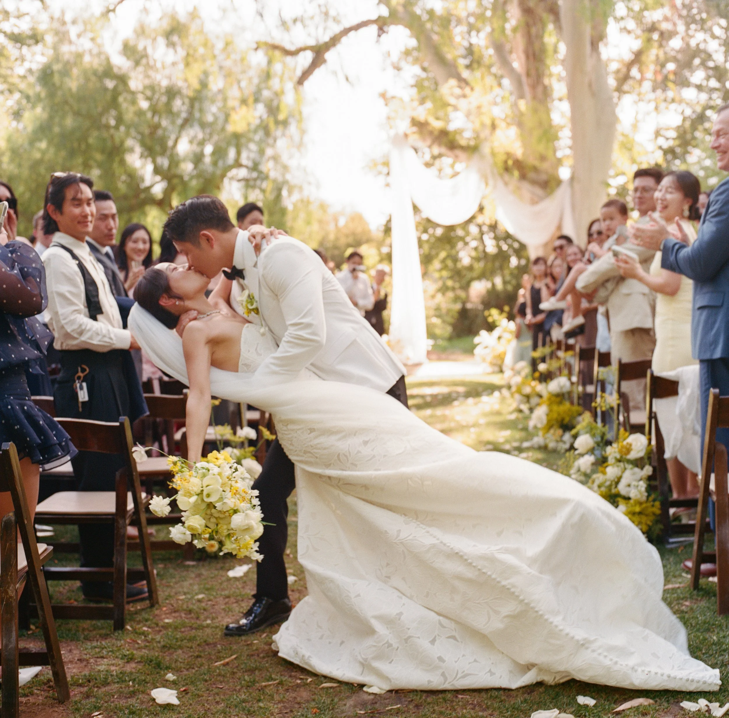 California Wedding in Temecula, CA. Bride and Groom kiss after their ceremony.
