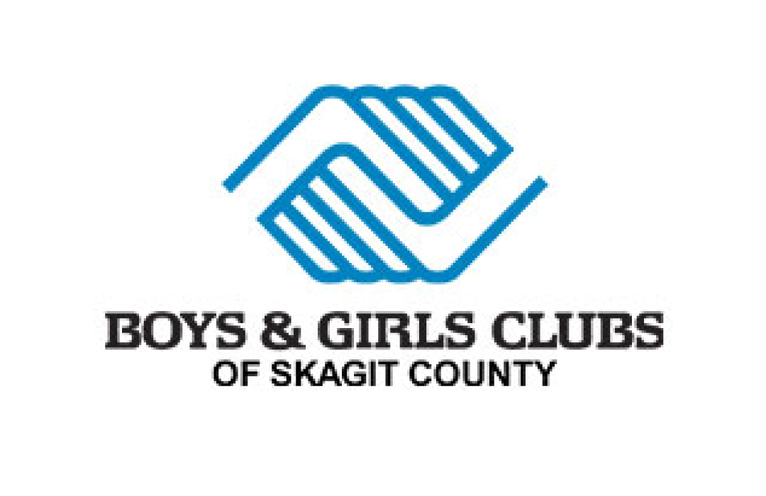 Logo of the Boys & Girls Clubs of Skagit County featuring two interlocking stylized hands in blue and black text below.