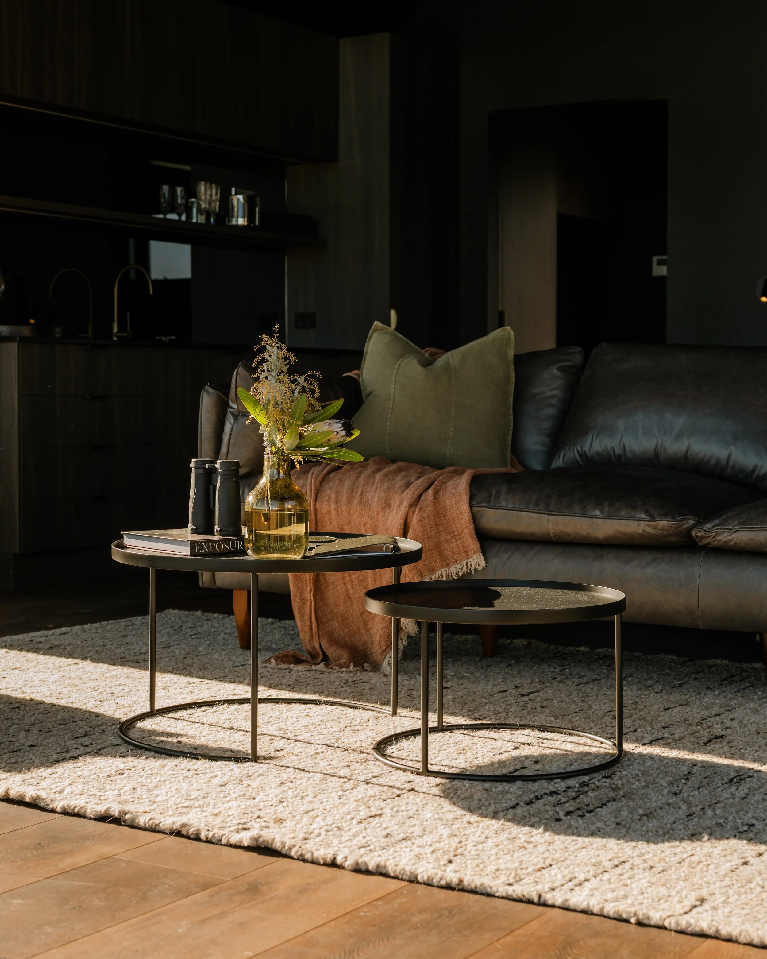 Retreat lounge with leather sofa and throw – luxury accommodation Freycinet, Tasmania