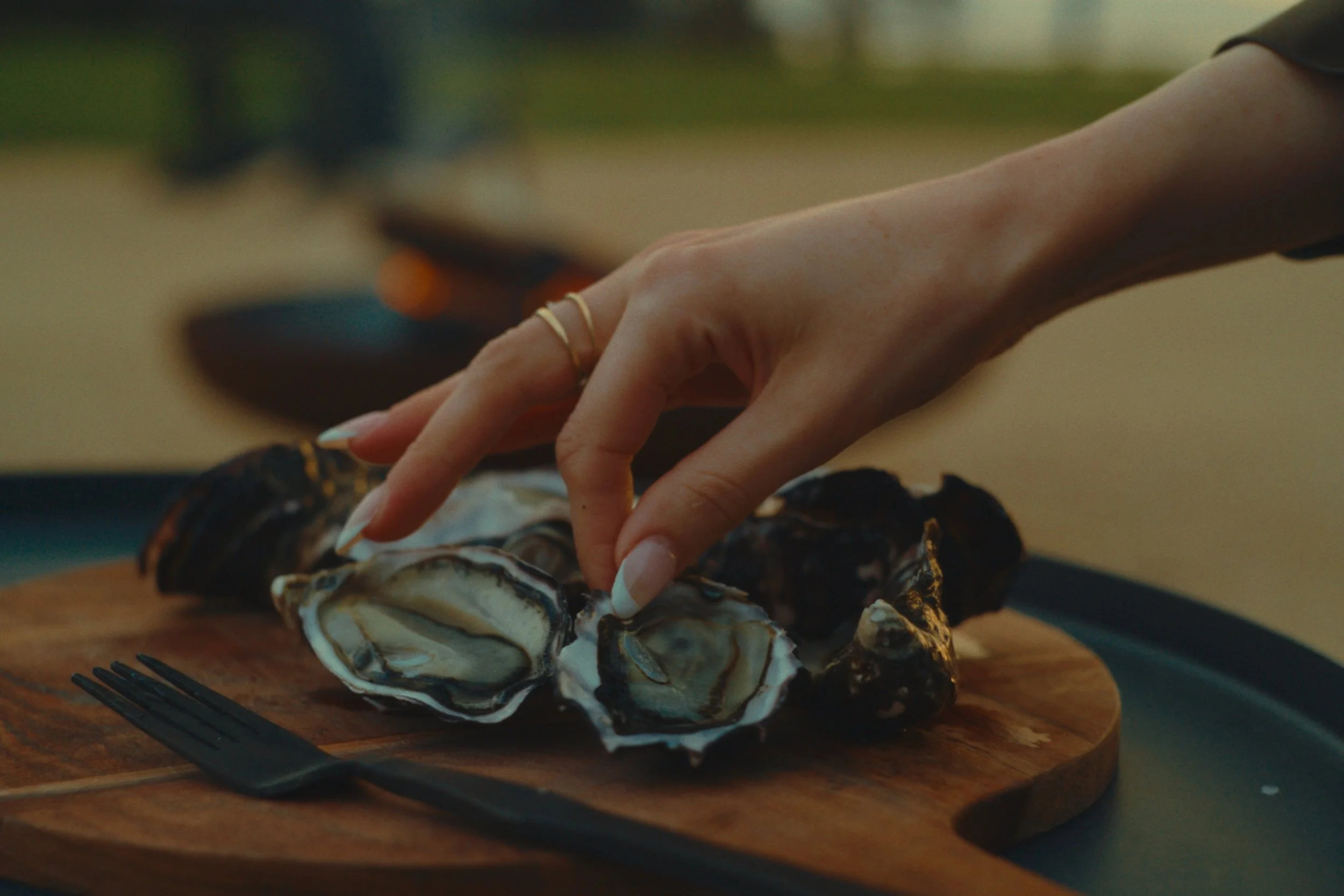 Fresh oysters on a timber board at Wineglass Bay Estate near Freycinet