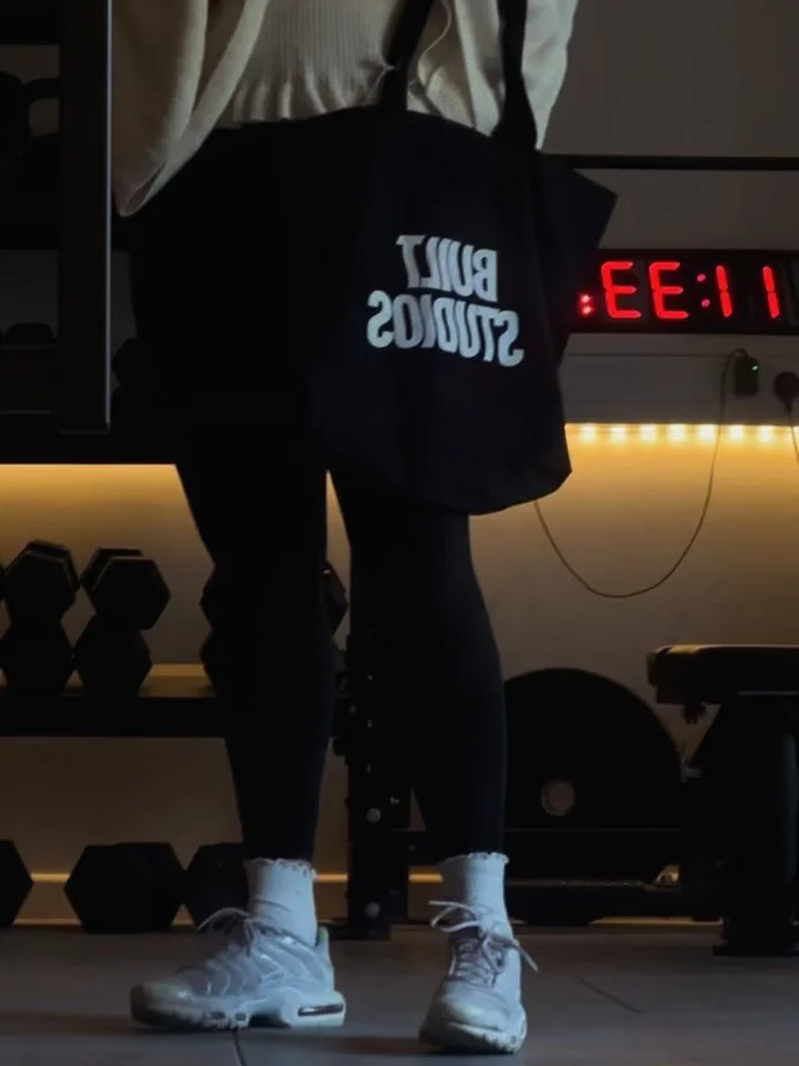 Easiest way to get Built? Get the merch 🔥

Secure the bag (literally) in studio or even pick up a hoodie. Oversized fit + gym = perfect training combo 

Tote: &pound;11.99
Hoodie: &pound;38

Members get 10% off 👀

What&rsquo;re you getting??? Let u