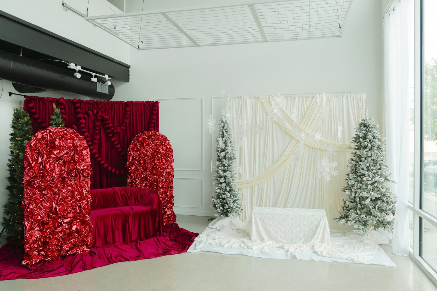 The Red Velvet and Winter White holiday sets side by side along one wall of the Alight Collaborative studio in Pflugerville, with the rest of the studio open