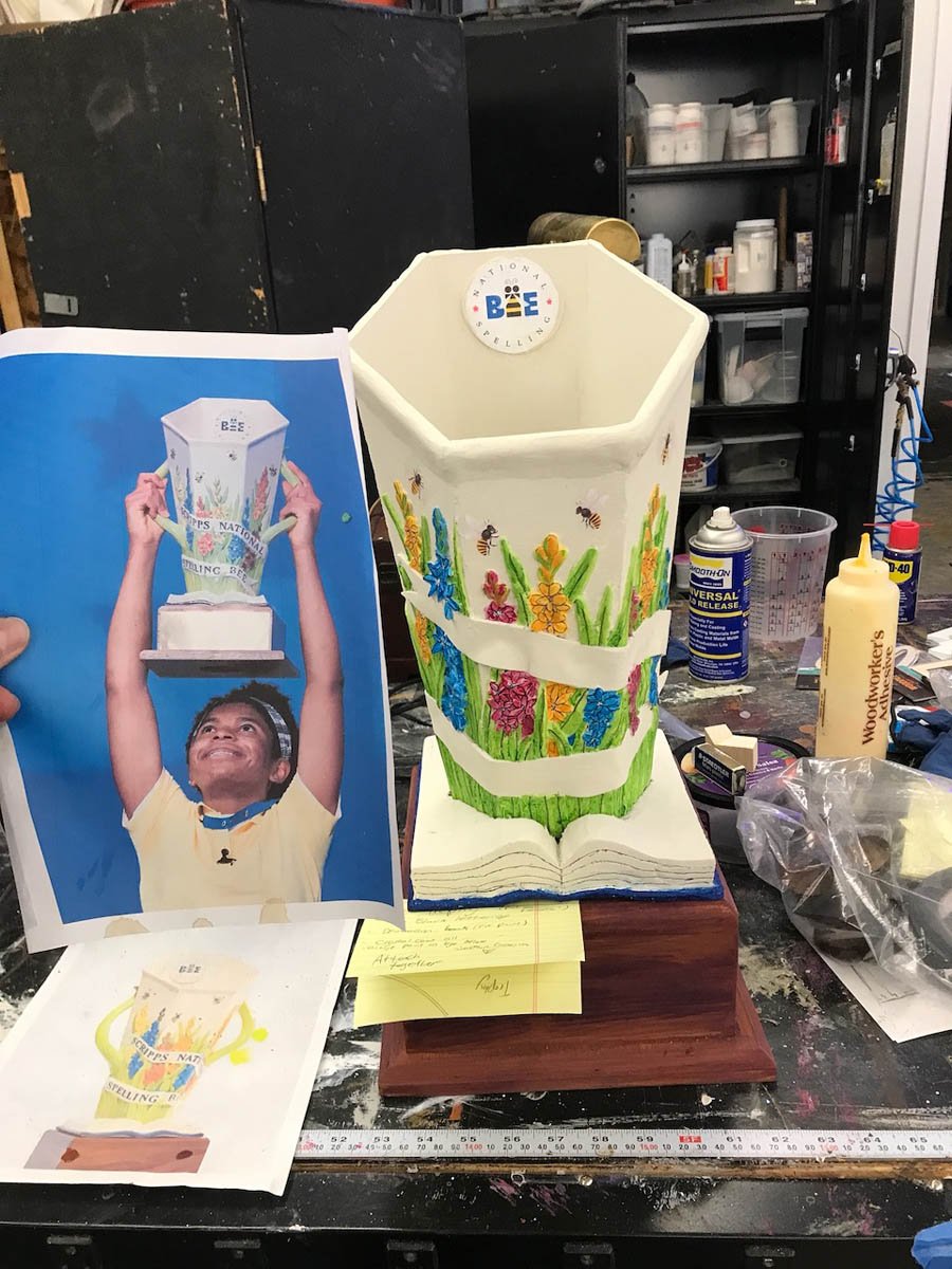 UNCO: Akeelah and the Bee-Hero prop- Scripps spelling bee trophy recreation- built by student work studies in the prop shop. Shown in process with reference photo.