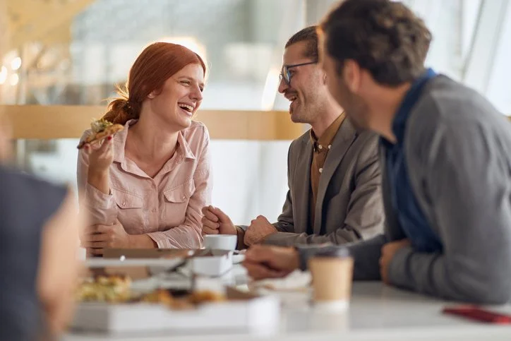 professionals having coffee and a relaxed conversation before a meeting