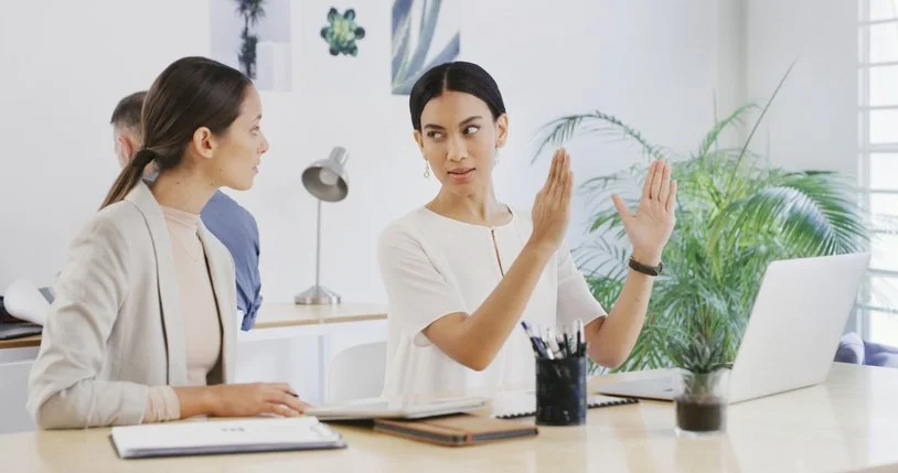 Professionals transitioning from small talk to a business discussion in a meeting