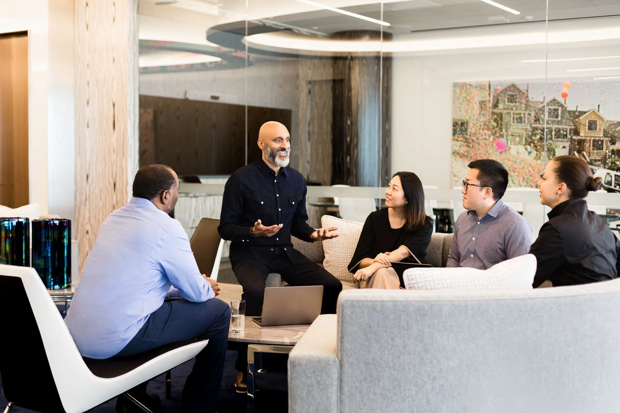 Commercial corporate lifestyle photo of Indian man coaching team in high end executive San Francisco law office, Bay Area corporate lifestyle photographer for legal and professional services brands