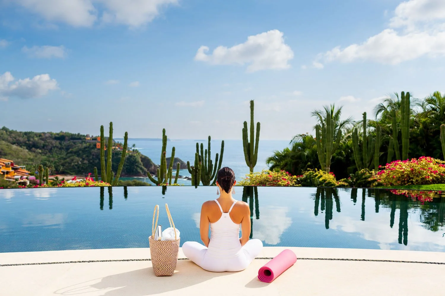 San Francisco yoga teacher meditating by infinity pool during commercial lifestyle shoot, Bay Area personal branding photographer for wellness and fitness brands