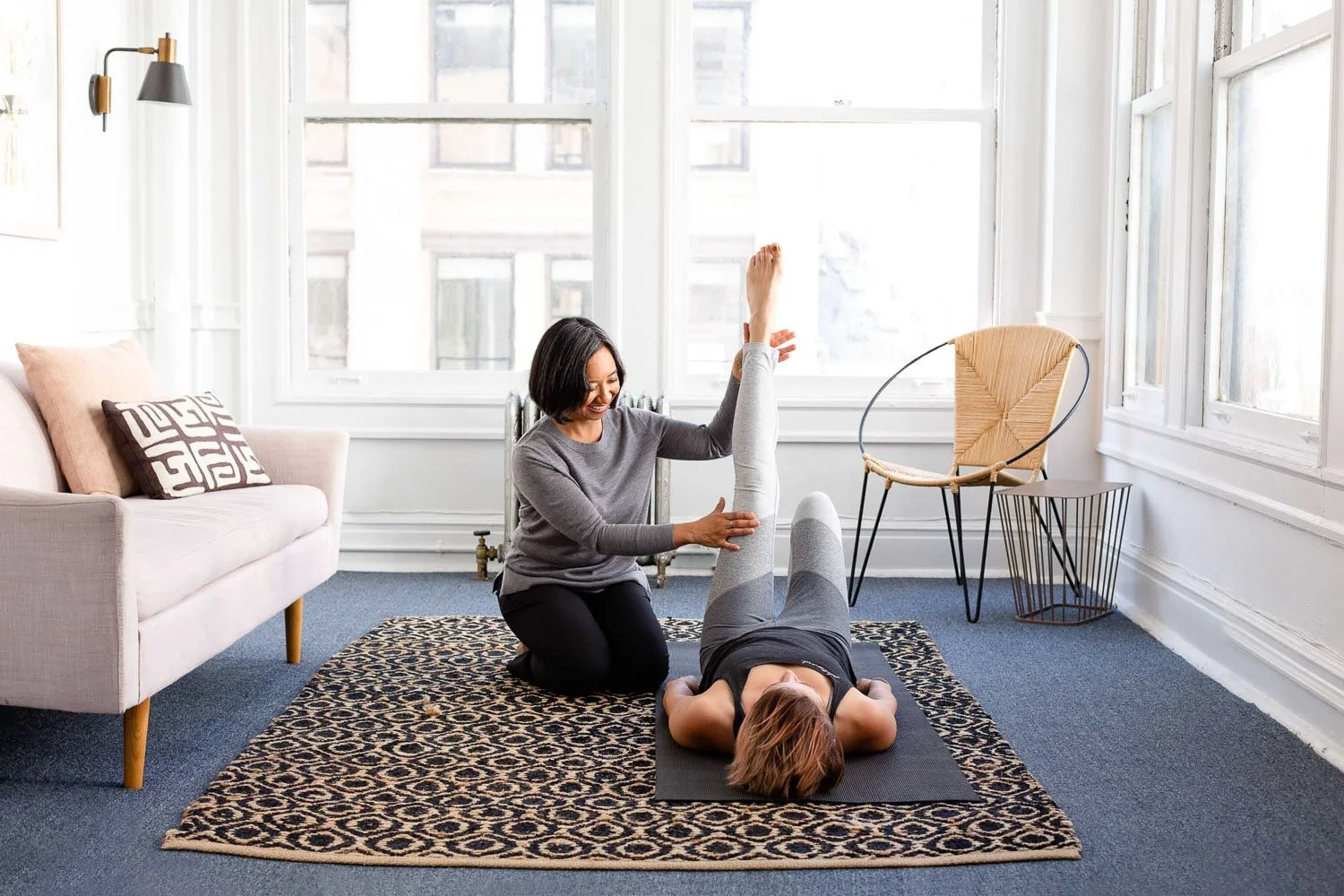 San Francisco physical therapist during commercial lifestyle branding shoot practicing assisted stretching, Bay Area personal branding photographer for healthcare and wellness brands