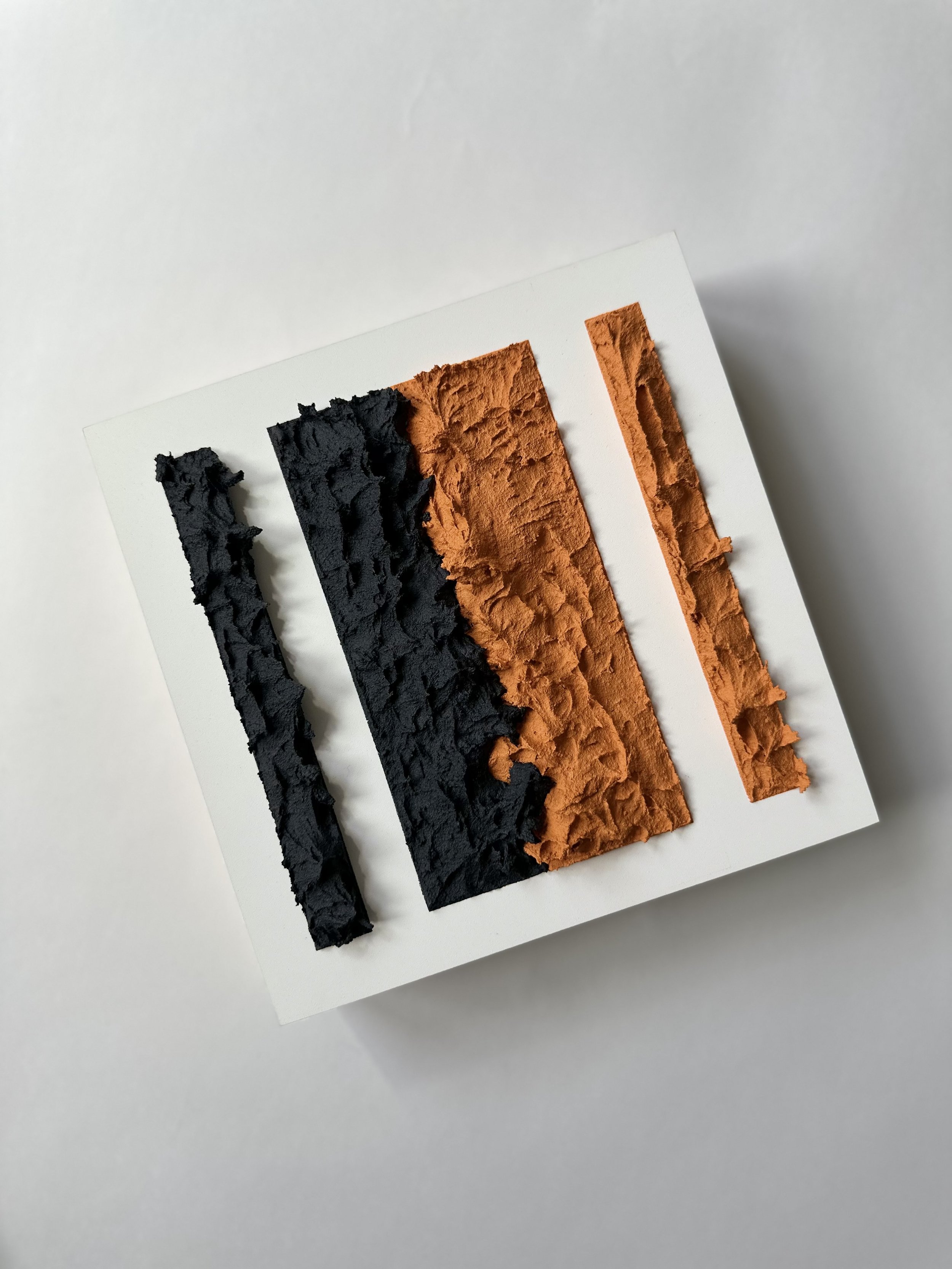 Abstract art with textured black and orange stripes on white background.