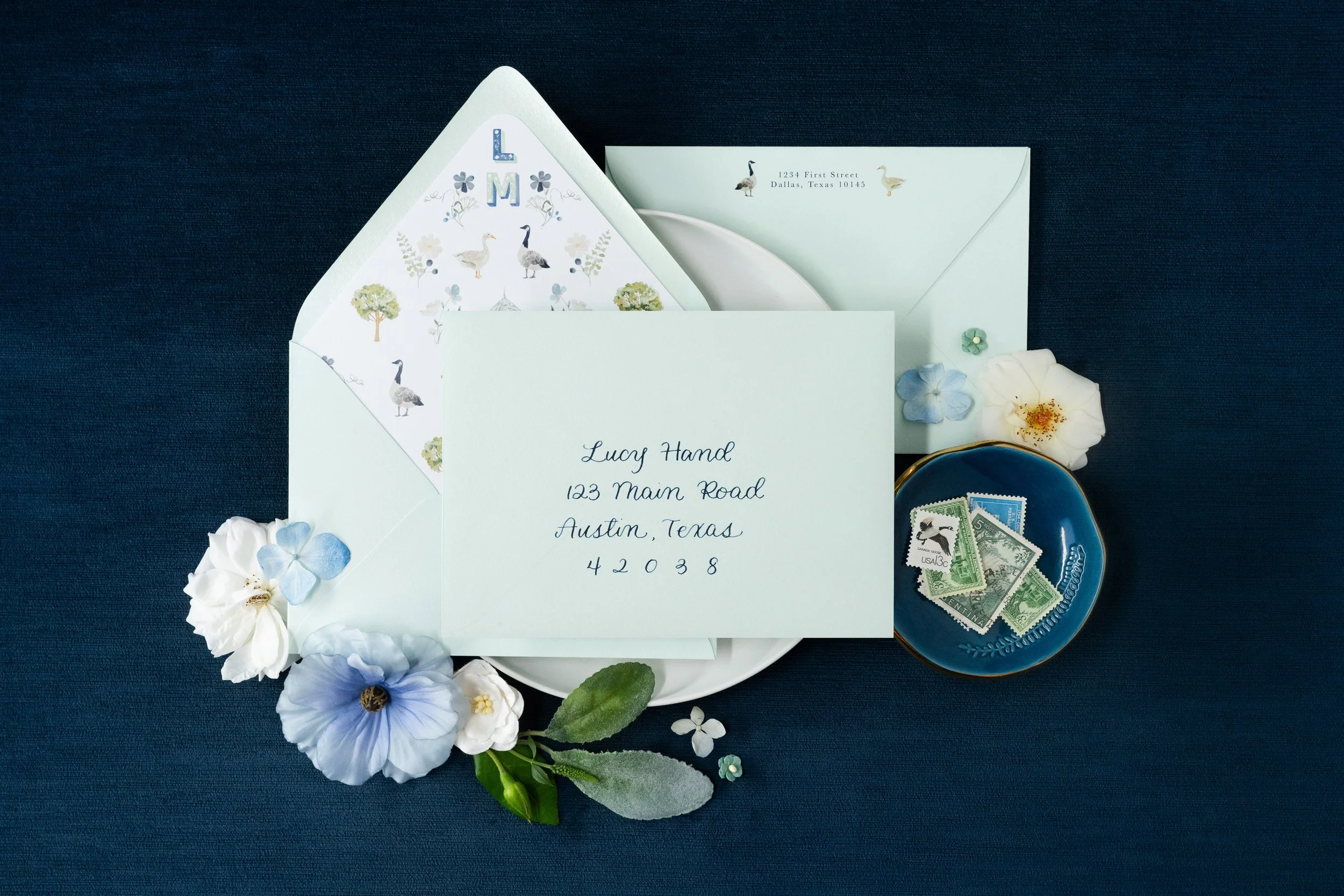 custom-wedding-stationery-flat-lay-blue-flowers
