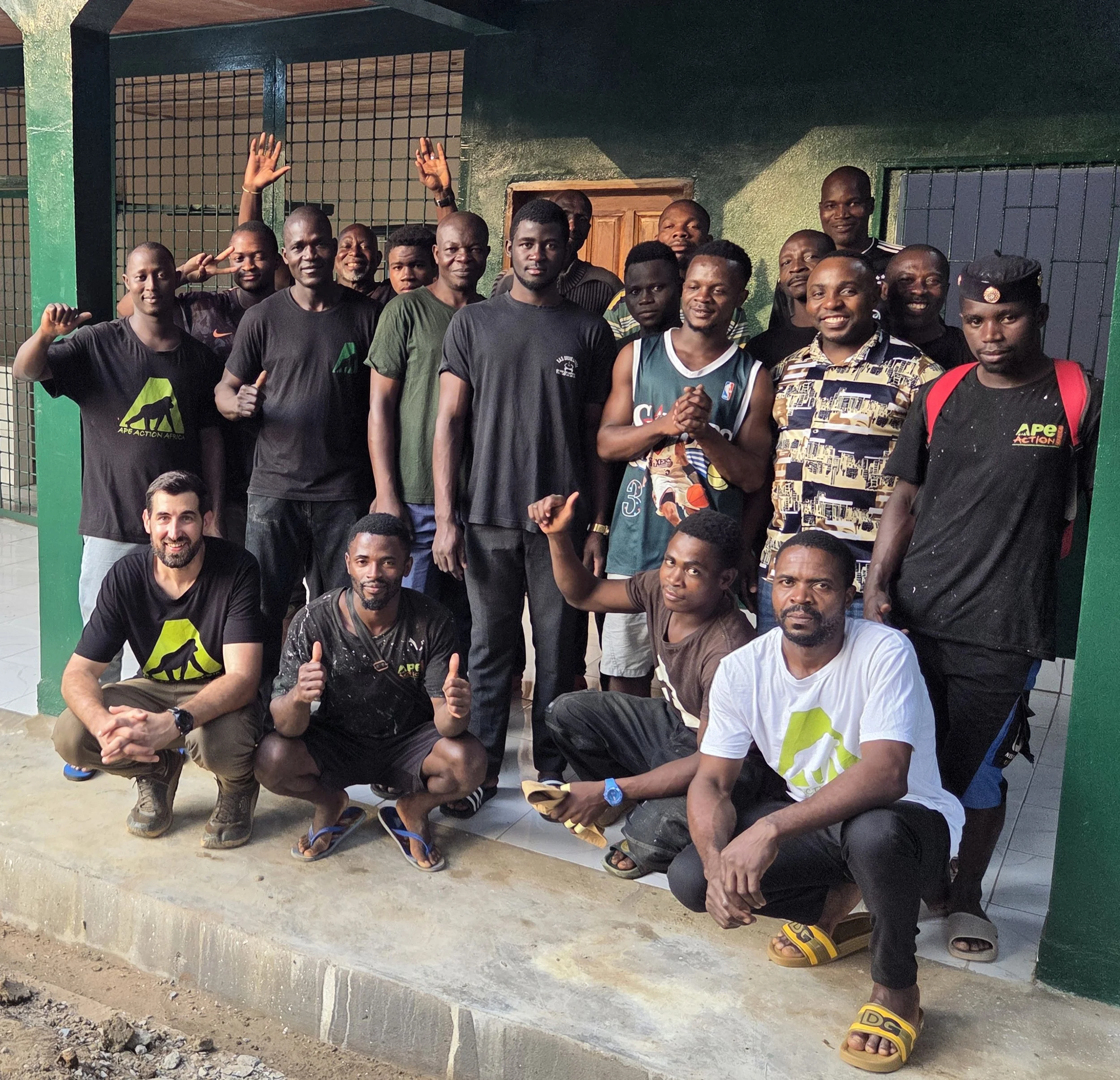 Construction team standing outside the new primate nursery at Ape Action Africa after completing the build in Cameroon
