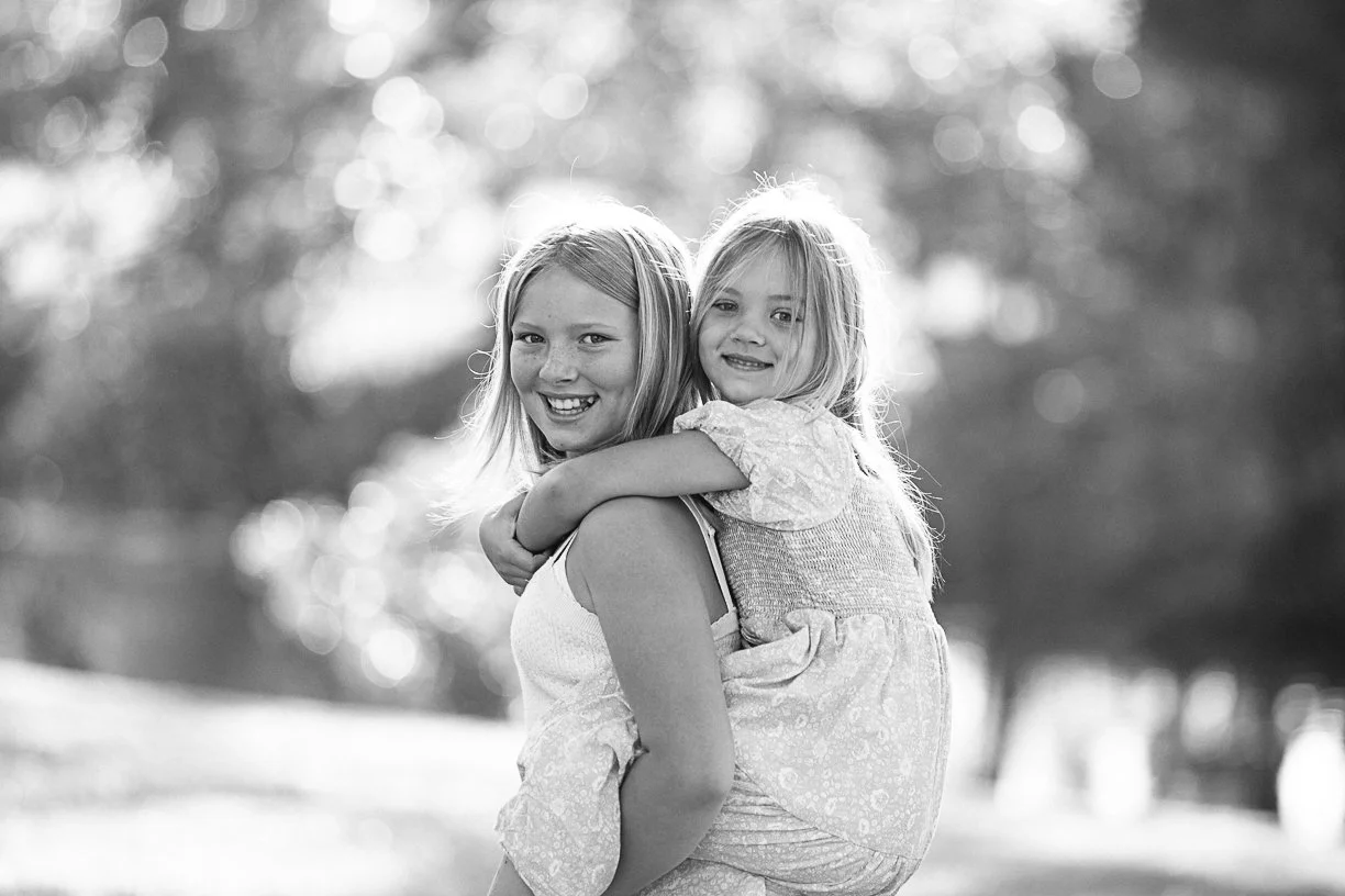 cutie sisters giving a piggy back ride in Long Beach, California