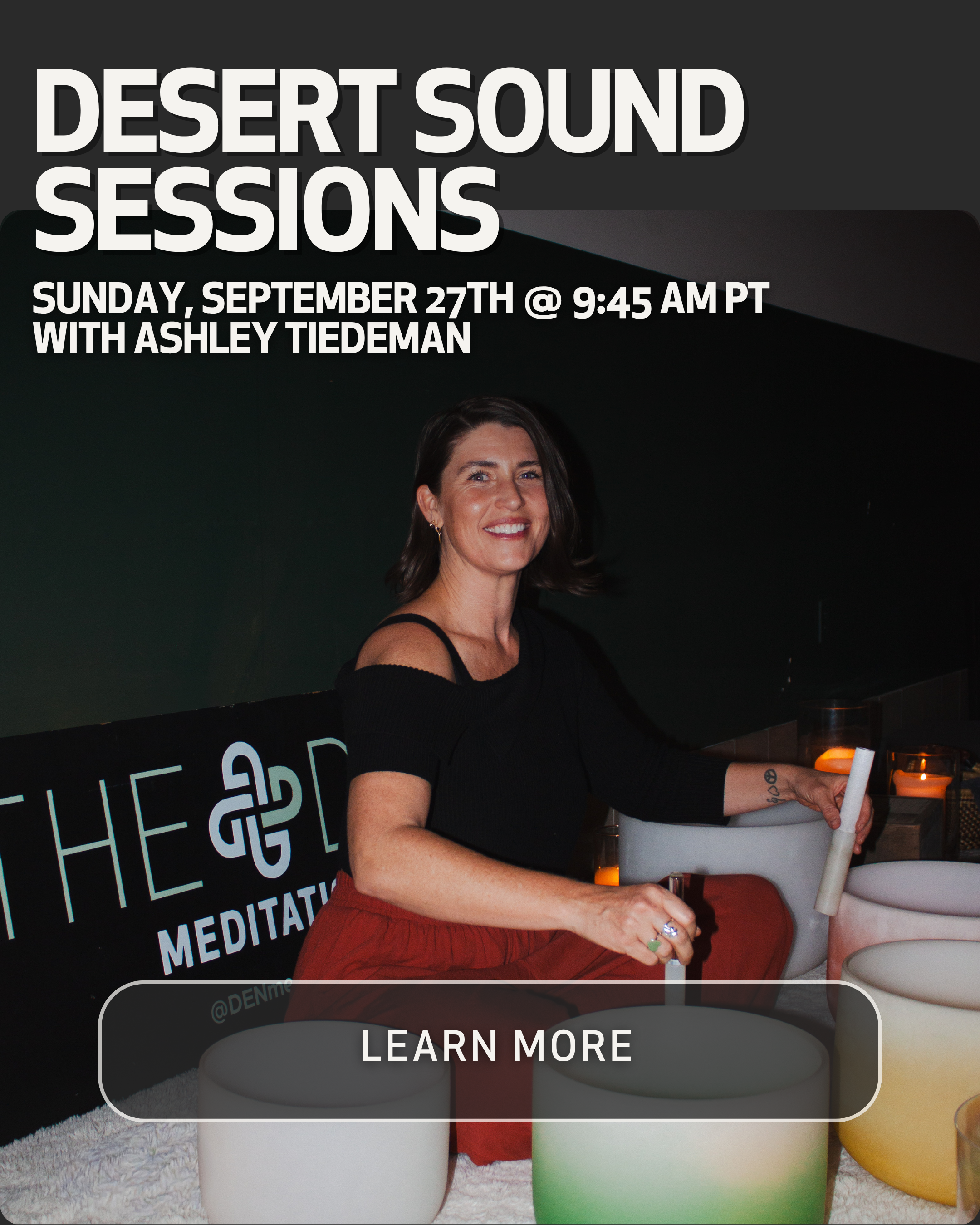 A woman with dark hair and a black top standing behind a white, green, and yellow ceramic container with candles on top, holding a white rolled object, in a meditation studio with a black wall and a sign that reads "THE SOUL of MEDITATION."