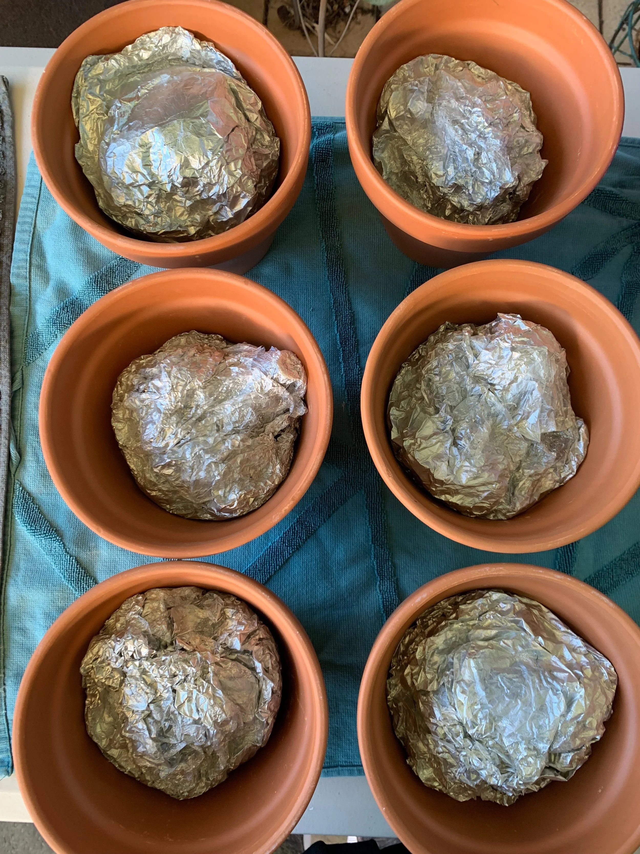 Foil saggars inside flowerpot sagas after firing