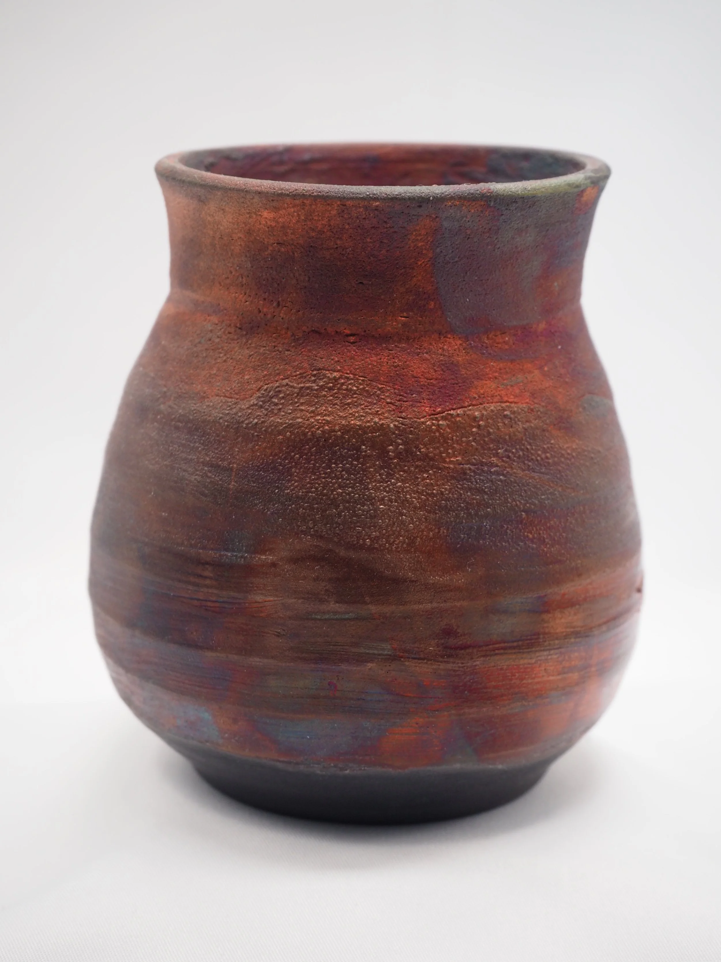 Raku cup - commercial 'oil slick' raku glaze with copper - fired at Tea Tree Studio 2022