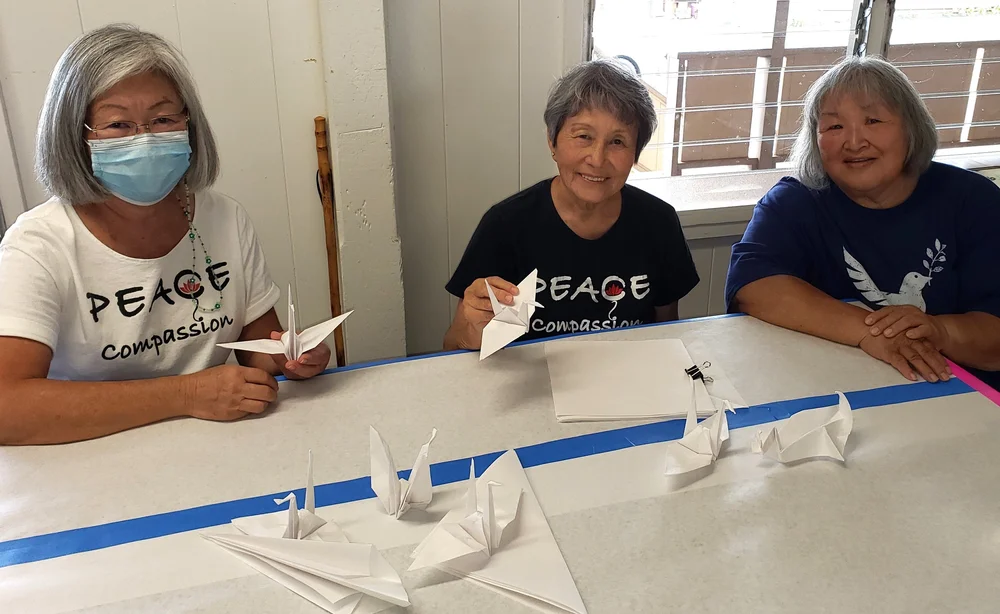 Enjoying Makawao's crafts table