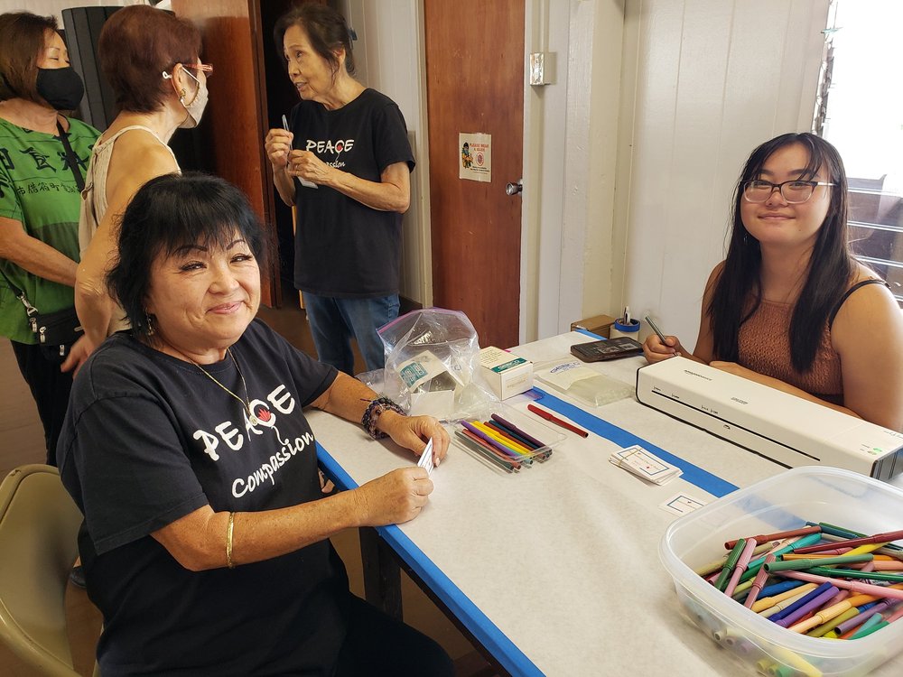Enjoying Makawao's crafts table