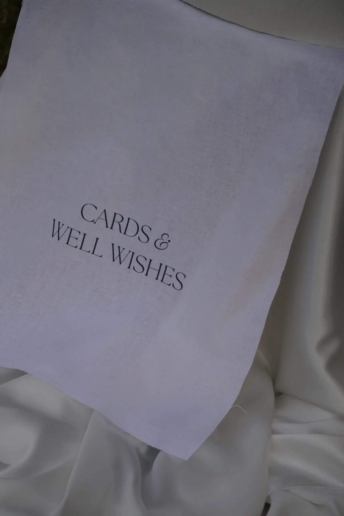 Card and well wishes linen sign.webp