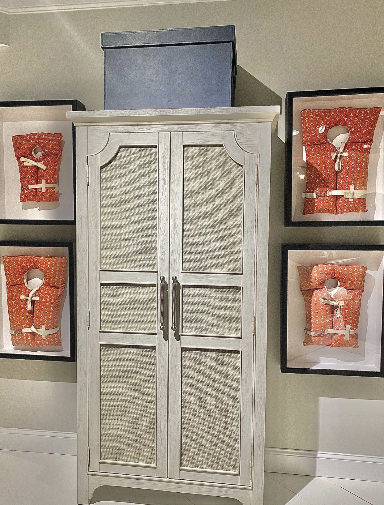 Wicker insert armoire with orange accessories .jpg