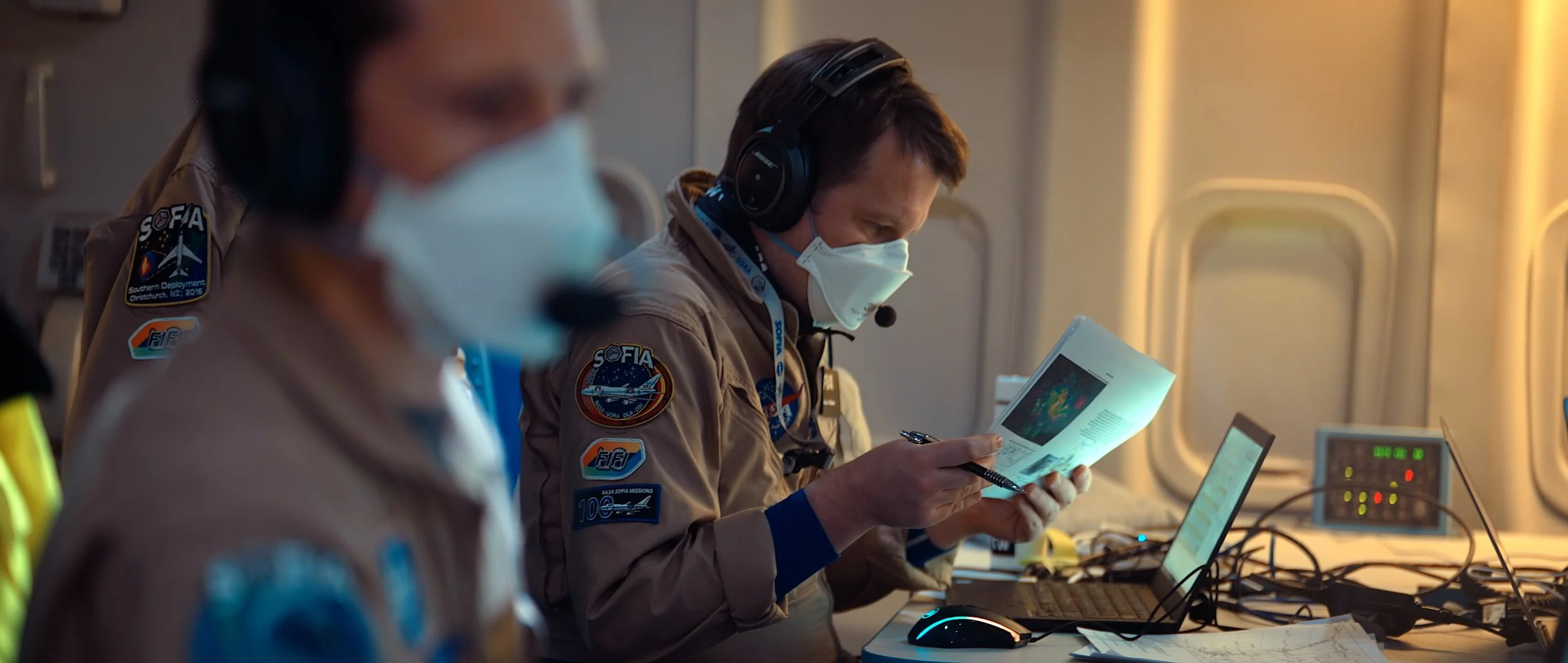 Mission team monitoring observations during a SOFIA flight