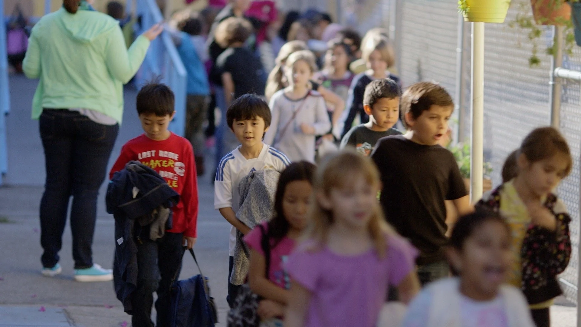 Students walking together through Citizens of the World Charter School