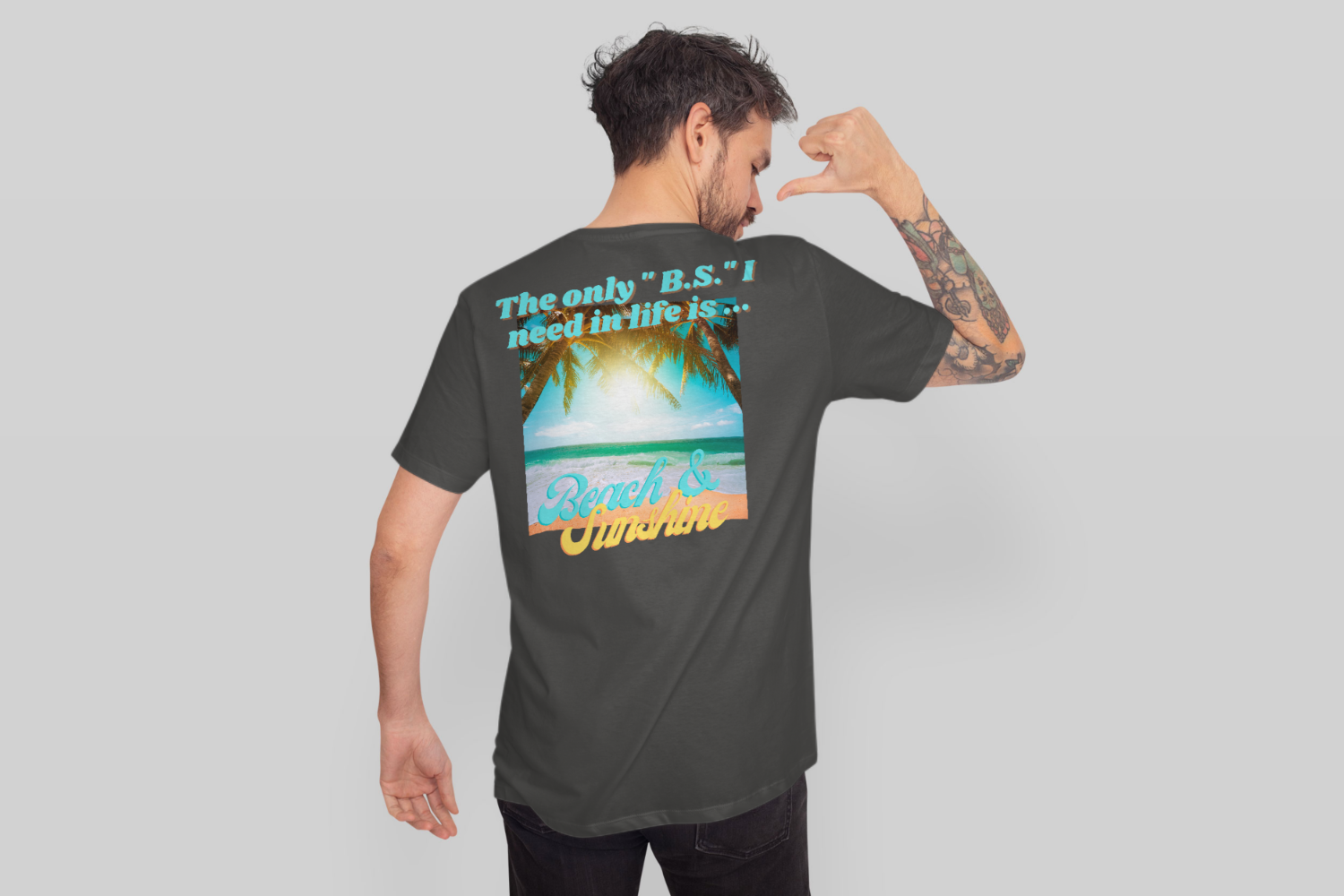 standing backwards pointing to t-shirt mockup-1500x1000.png