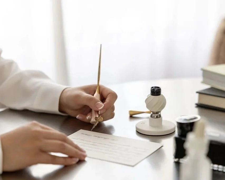 Brisbane-based calligraphy artist Zhao Chia Grey Lavender Calligraphy writing a custom commission handwritten letter in calligraphy